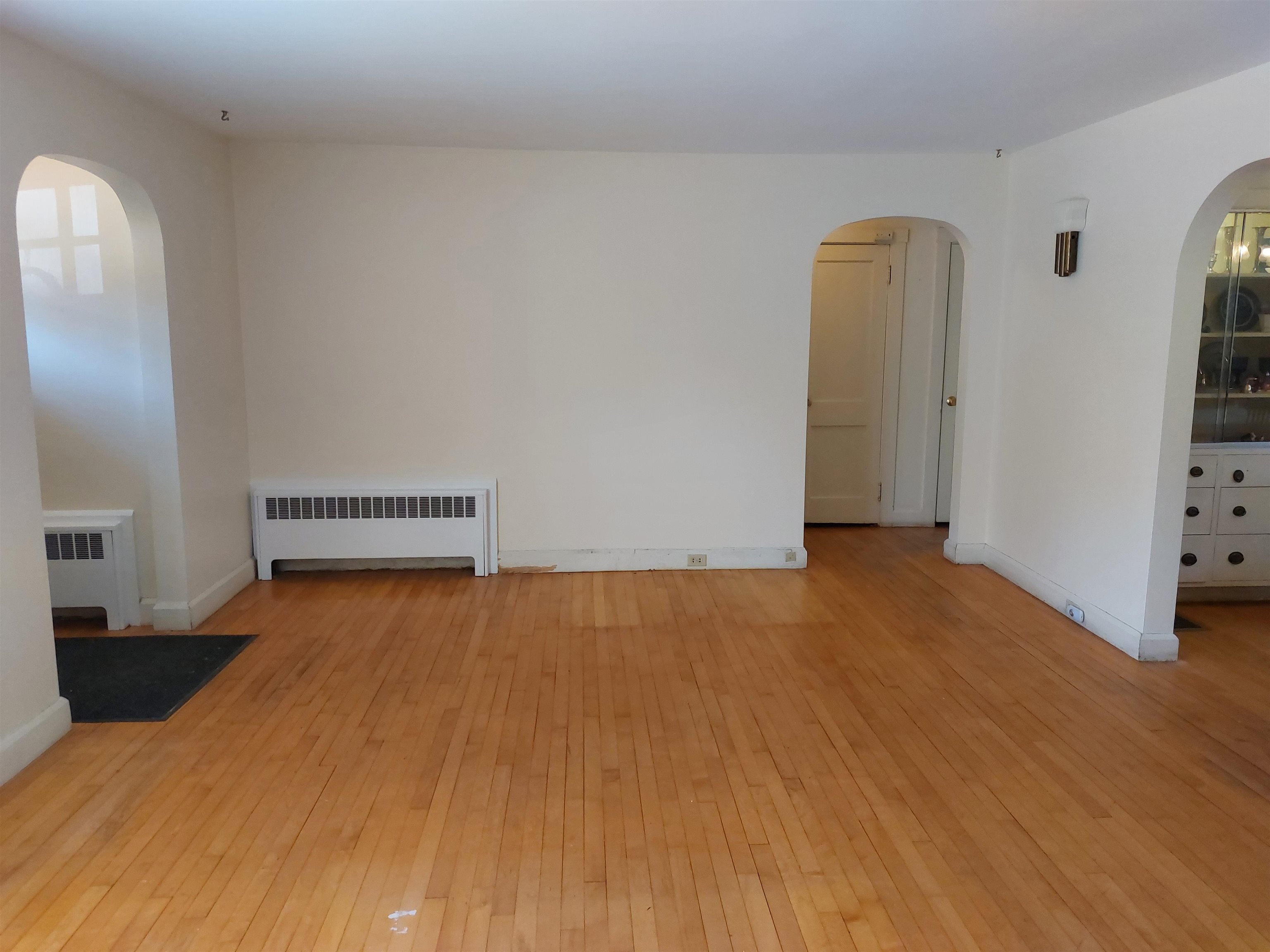 Other view of Living Room towards front door and 1st flr bdms