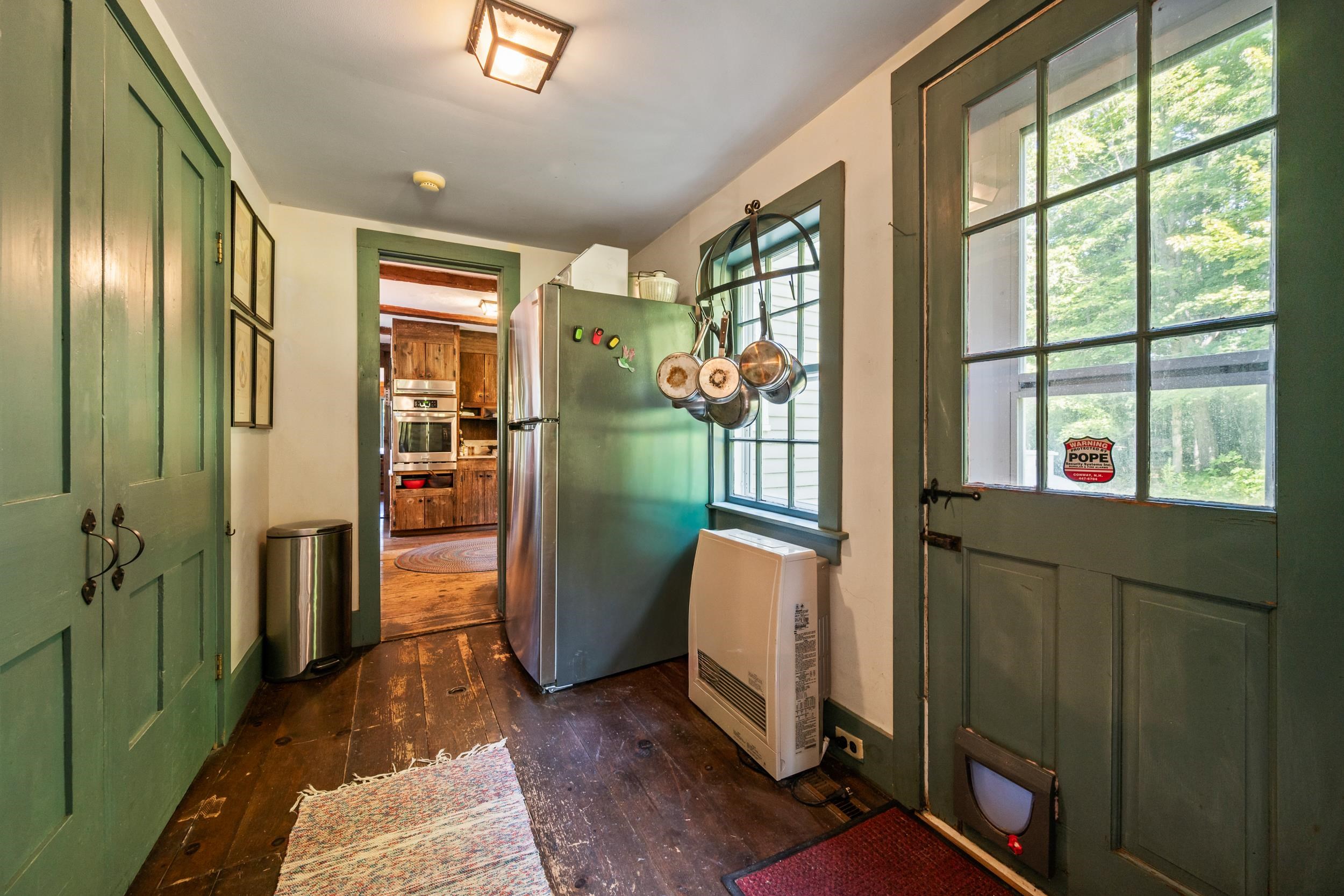 OFF THE KITCHEN IS THE LAUNDRY CLOSET AND FIRST OF THE FULL BATHROOMS.