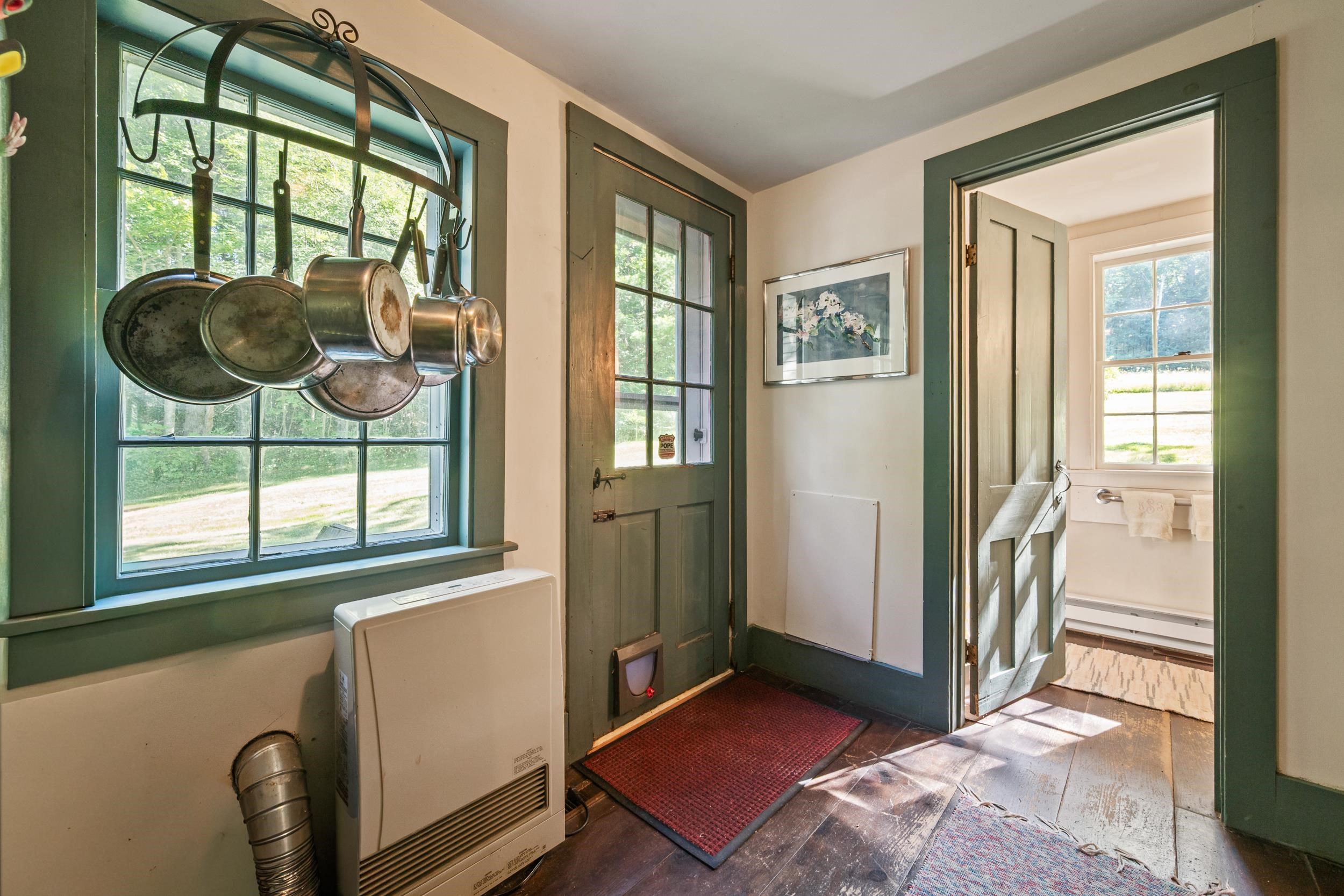 THRE IS A DOOR TO THE OUTSIDE IN THIS HALL.