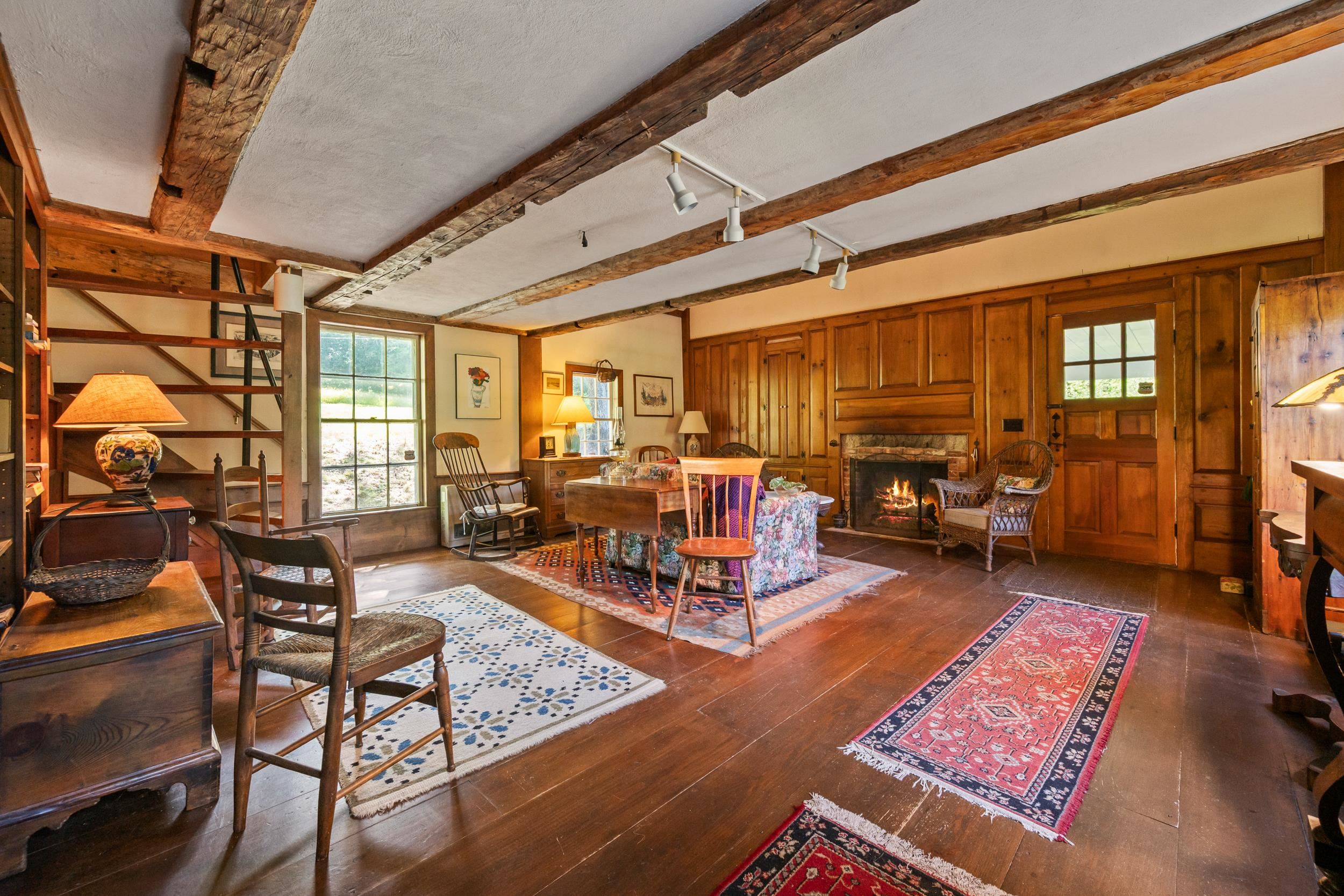 THIS ROOM LOOKS OLD WITH LOVELY WOOD FLOORS AND VAULTED CEILING!