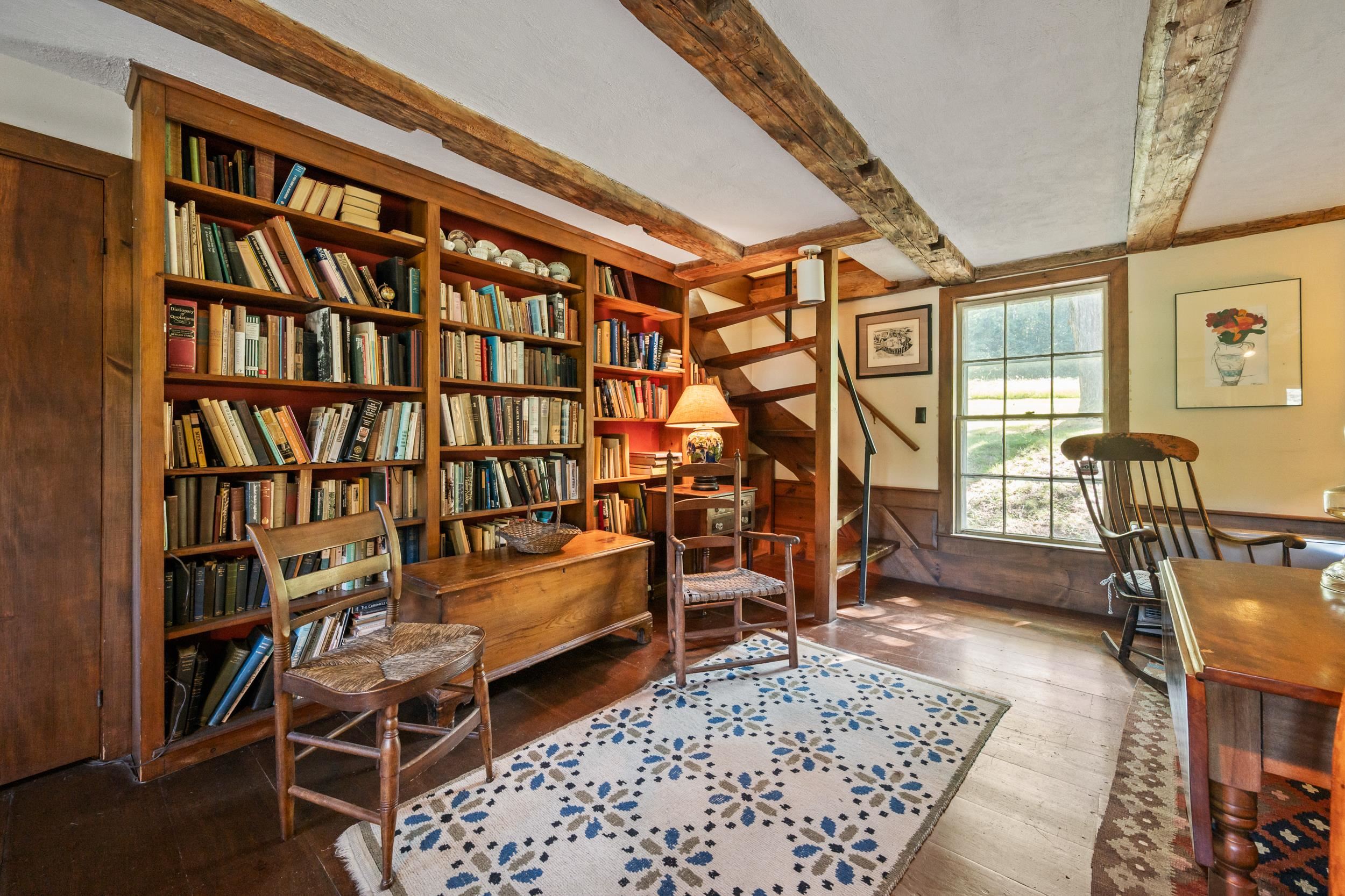 THE OPPOSITE WALL IS A WALL OF BOOK SHELVES!