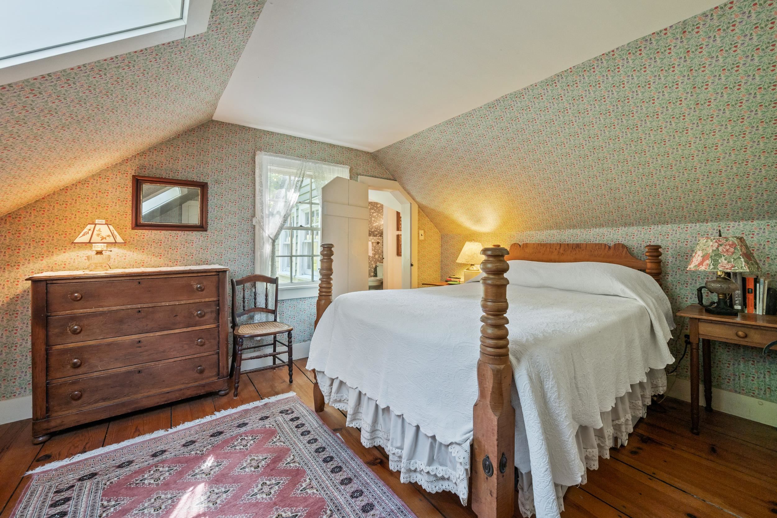 THE SECOND BEDROOM IS OFF THE FRONT STAIRWELL.