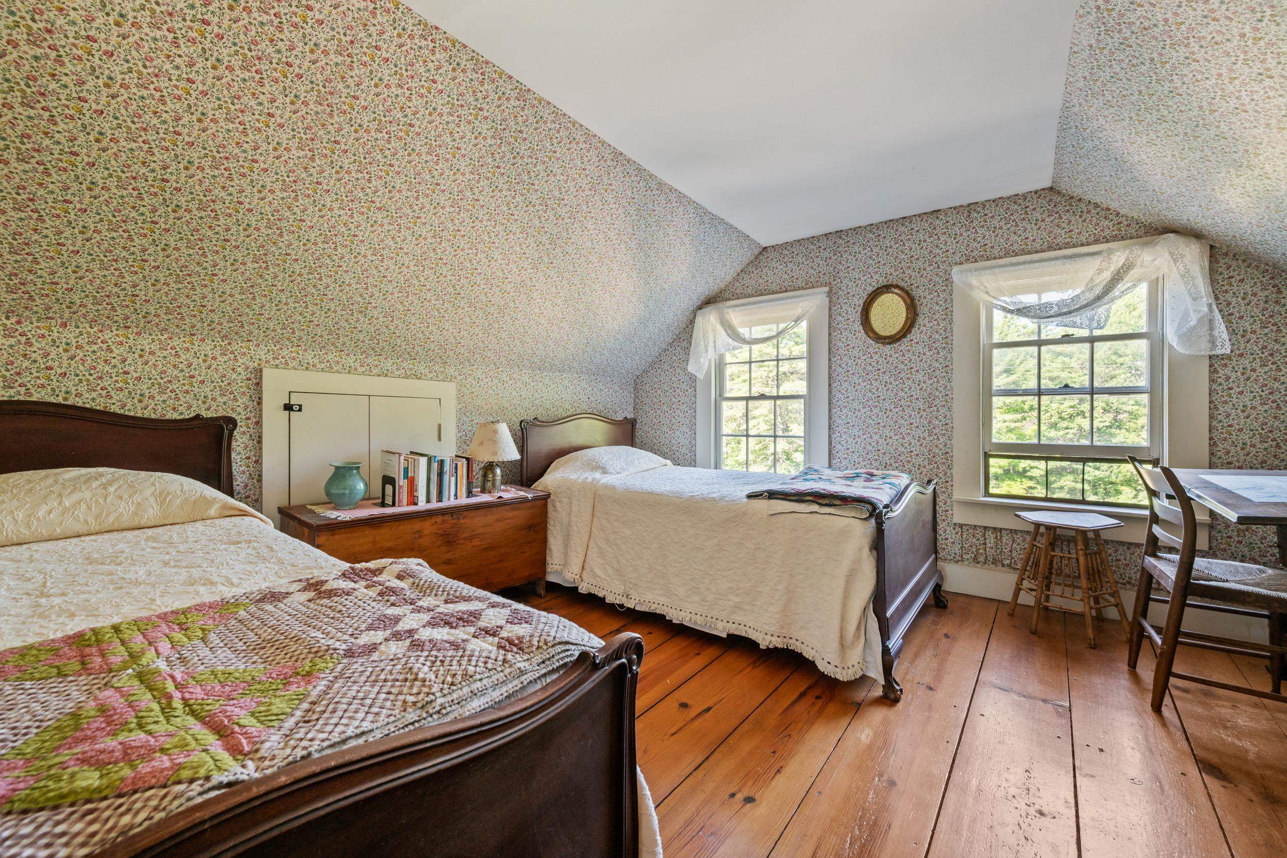 THE FRONT BEDROOM IS LARGE, PRESENTLY WITH TWO BEDS.  MUCH OF THE FURNITURE IS INCLUDED IN THIS SALE