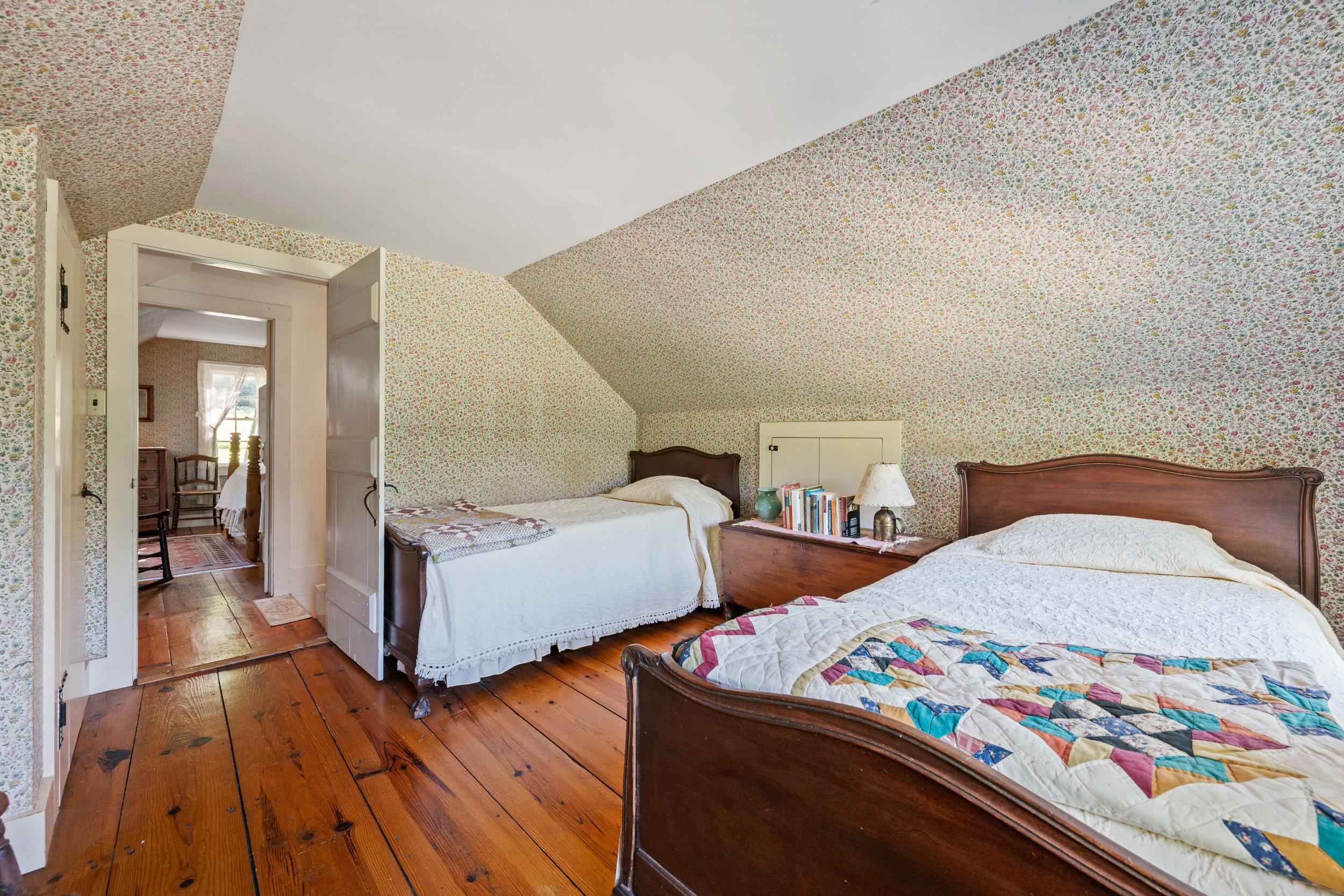 SO MANY OF THE OLDER FEATURES OF THE HOUSE HAVE BEEN RETAINED.  GREAT PAINTED WOOD WORK & WALLPAPER!