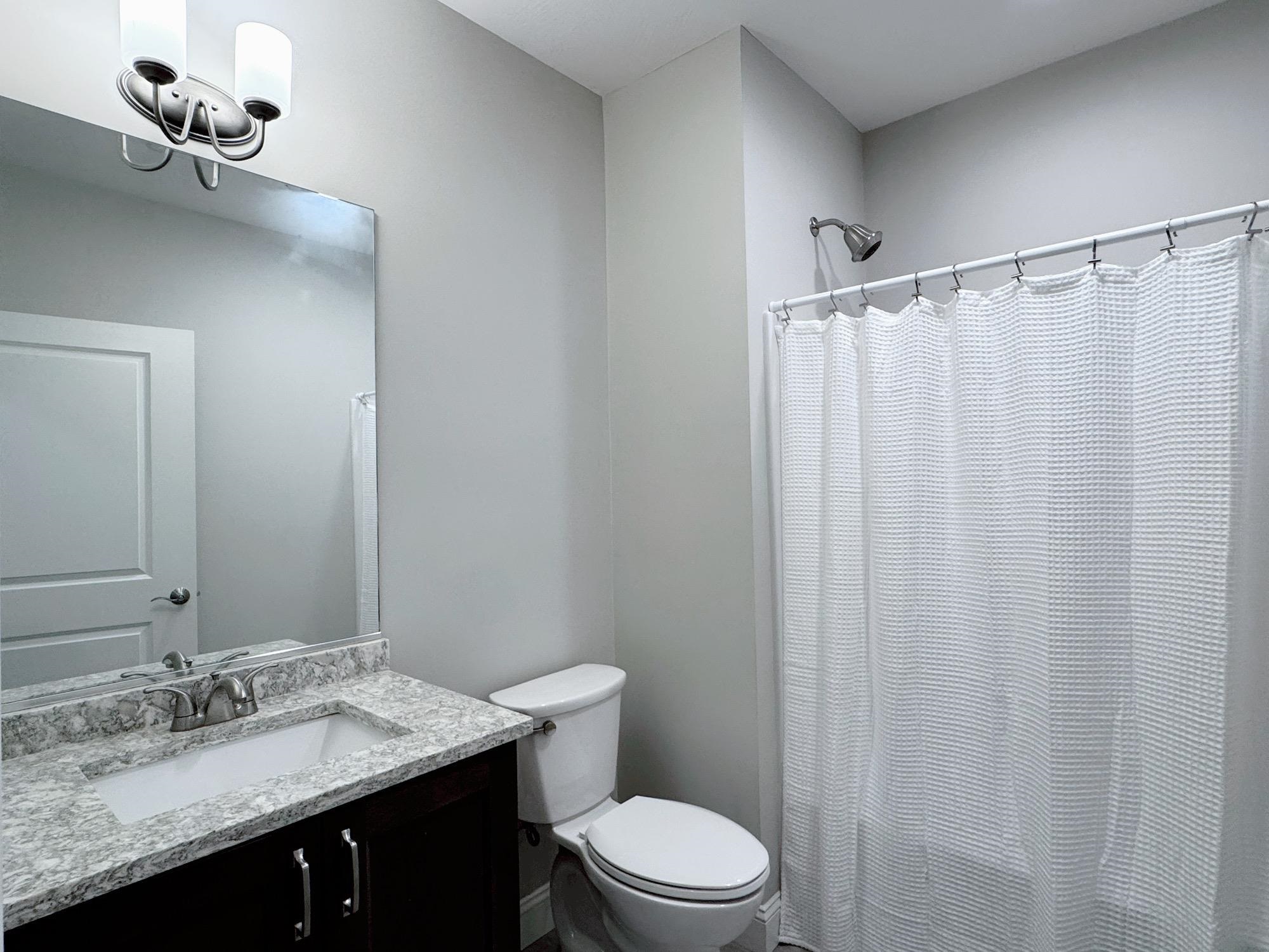 Full Tub and Tiled Flooring