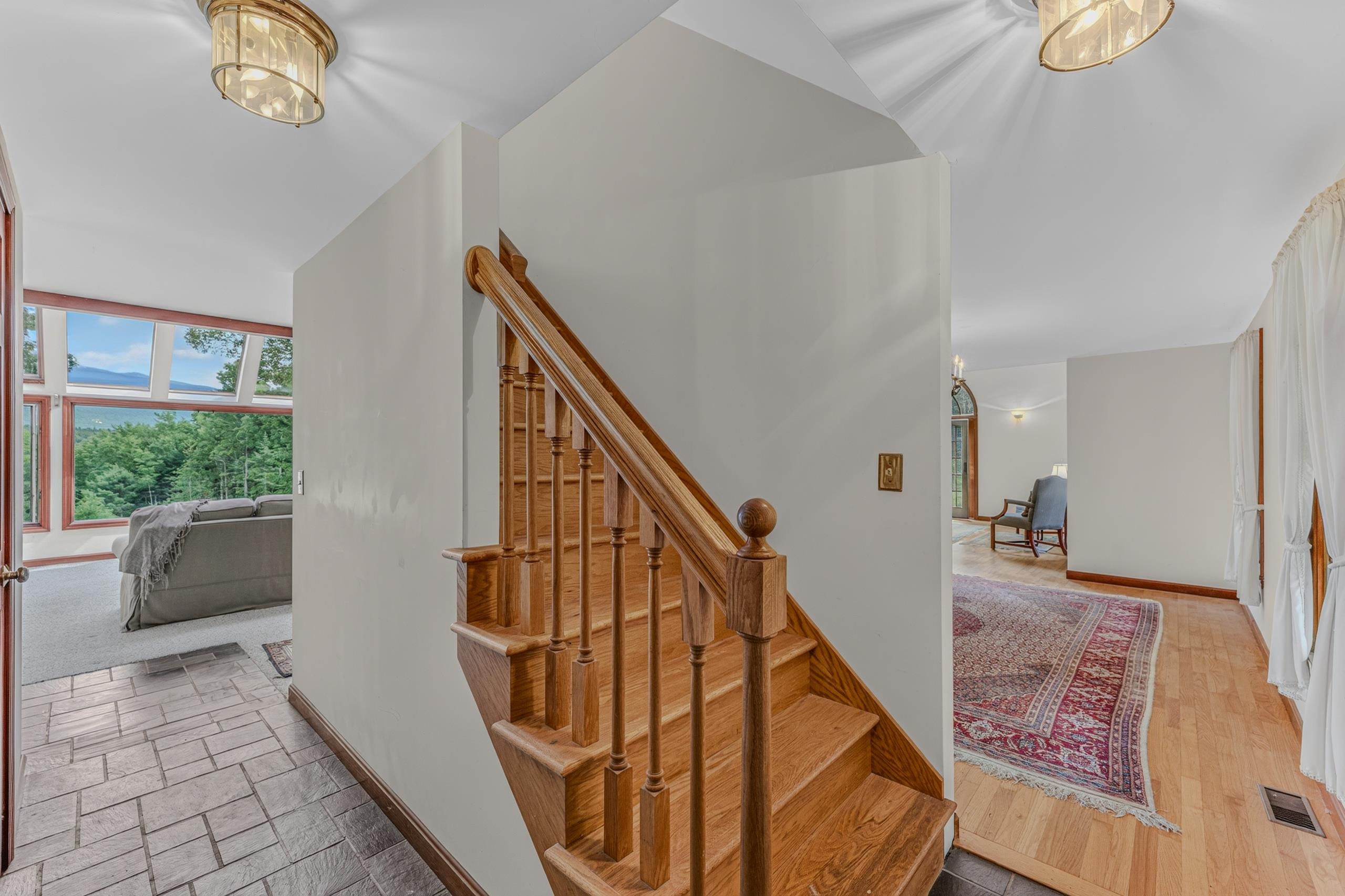 From Entry Looking Upstairs And To Family Room and Dining Room
