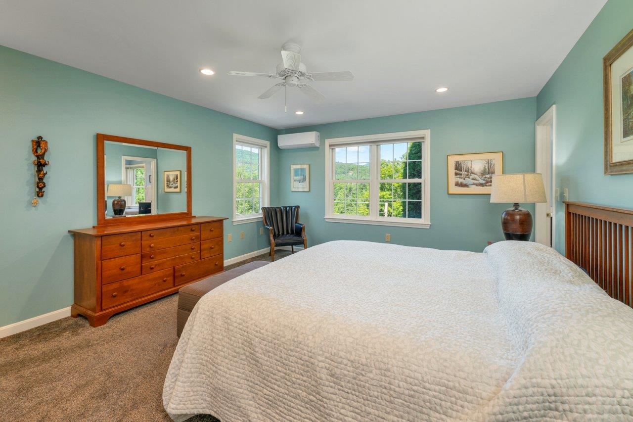 Wake up to views across the river to the mountains