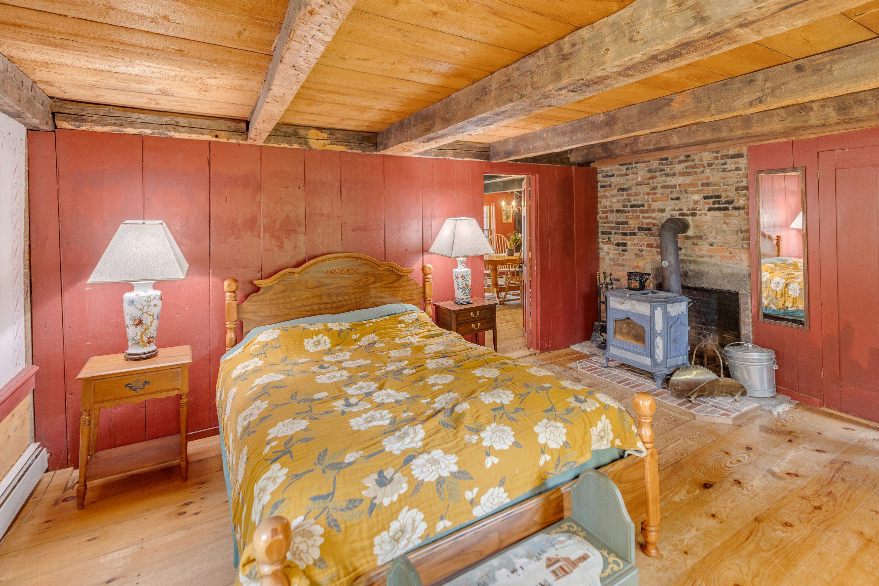 first floor bedroom with soapstone stove. 25888311