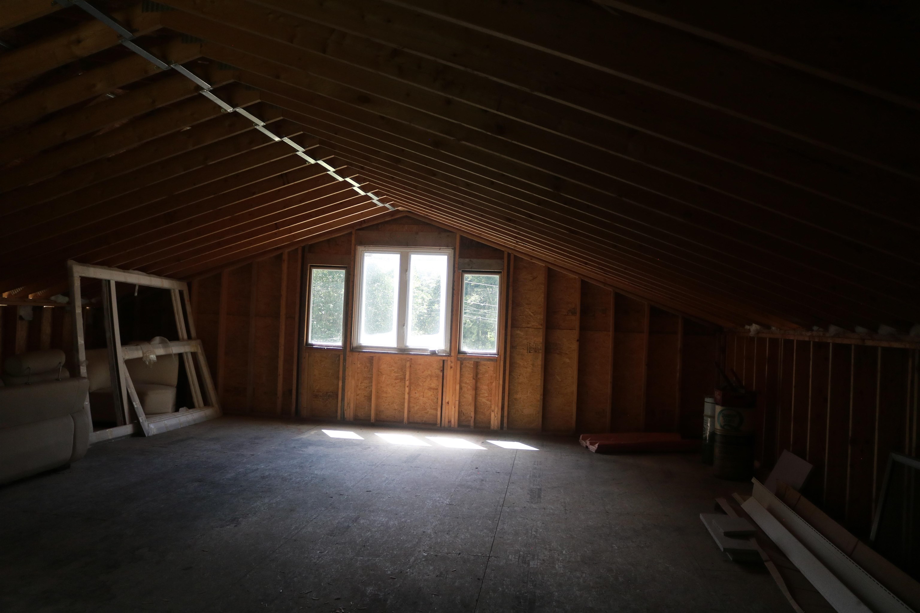 Unfinished loft with window