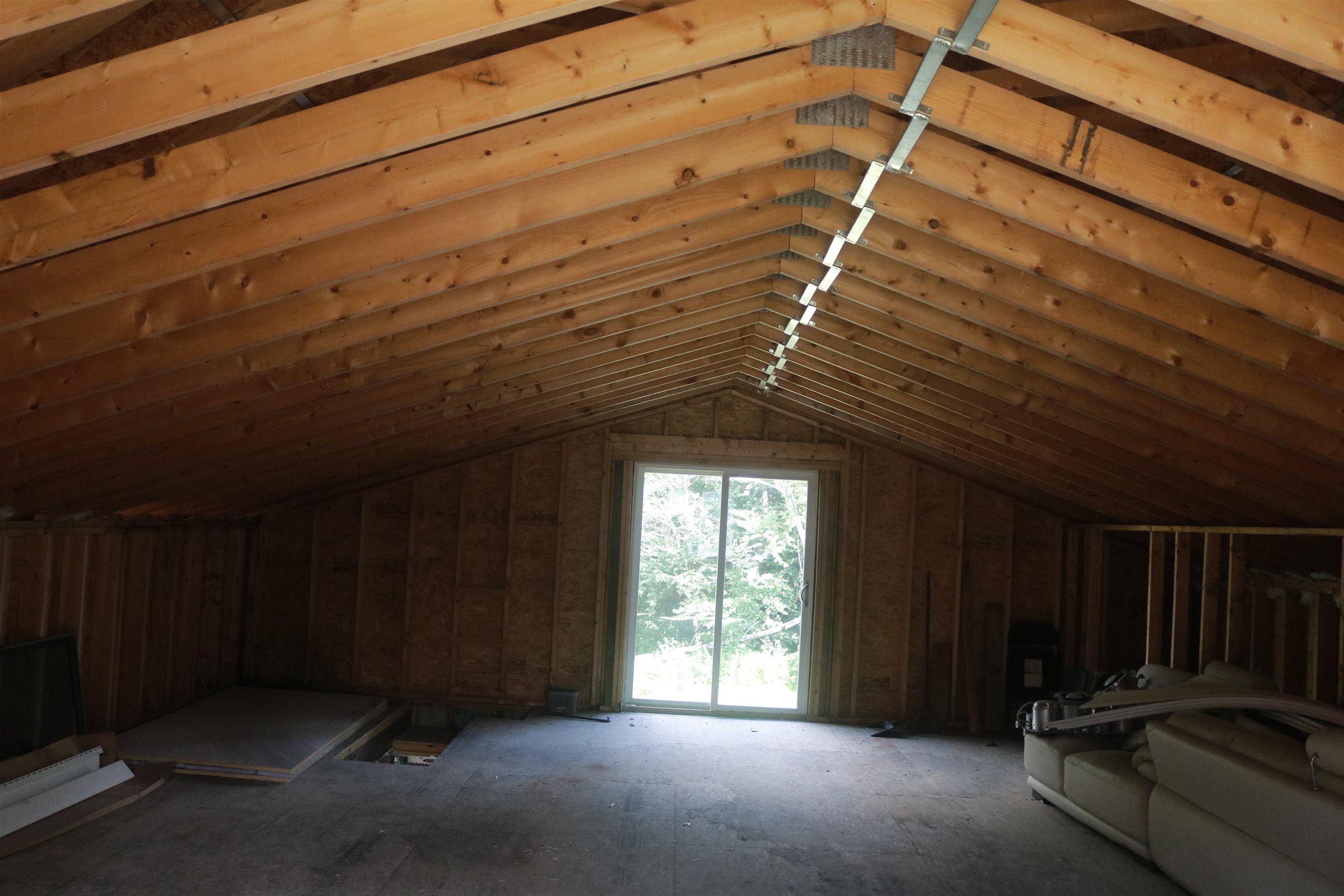 unfinished loft with slider