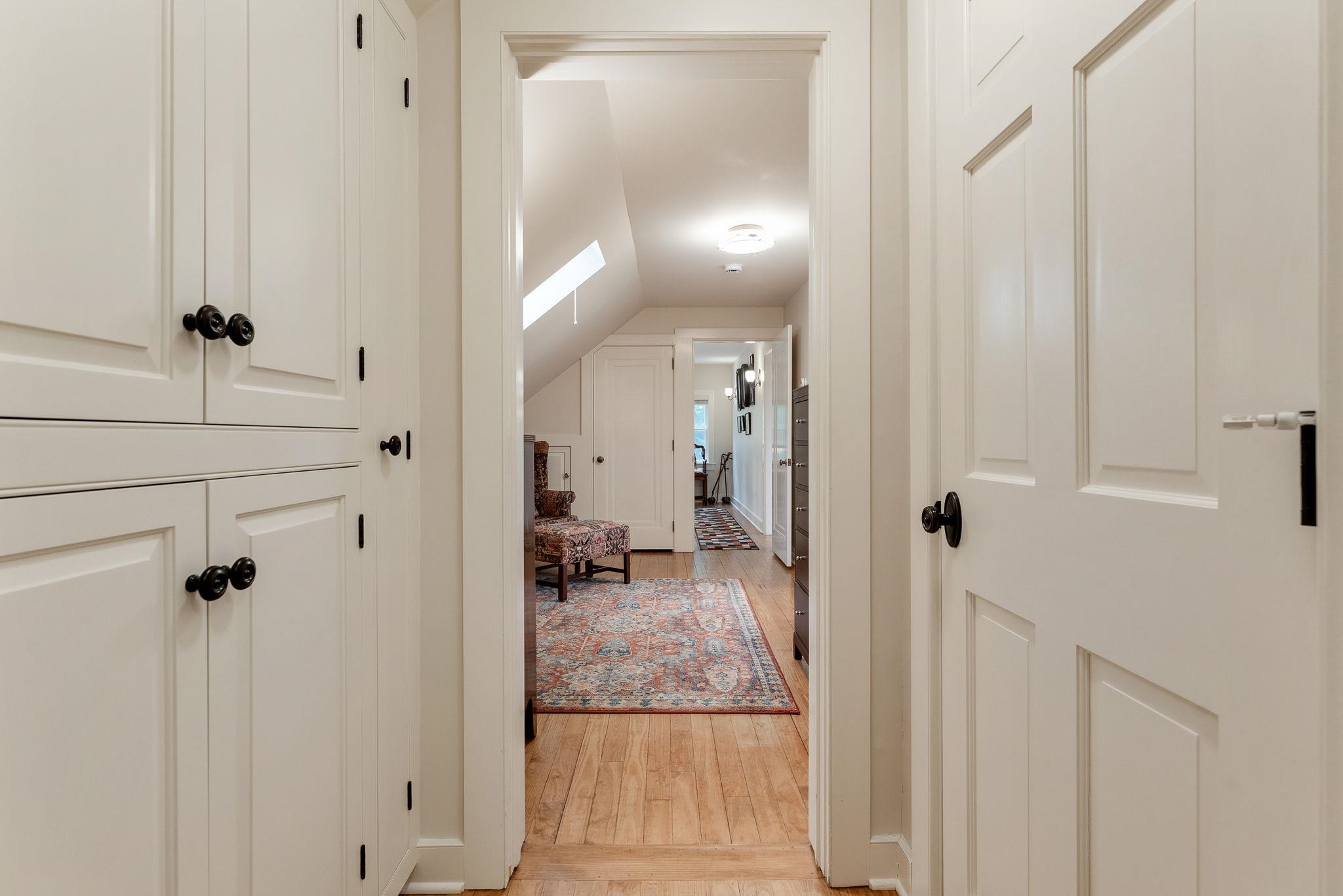 Primary suite hallway to dressing room/study 25903352
