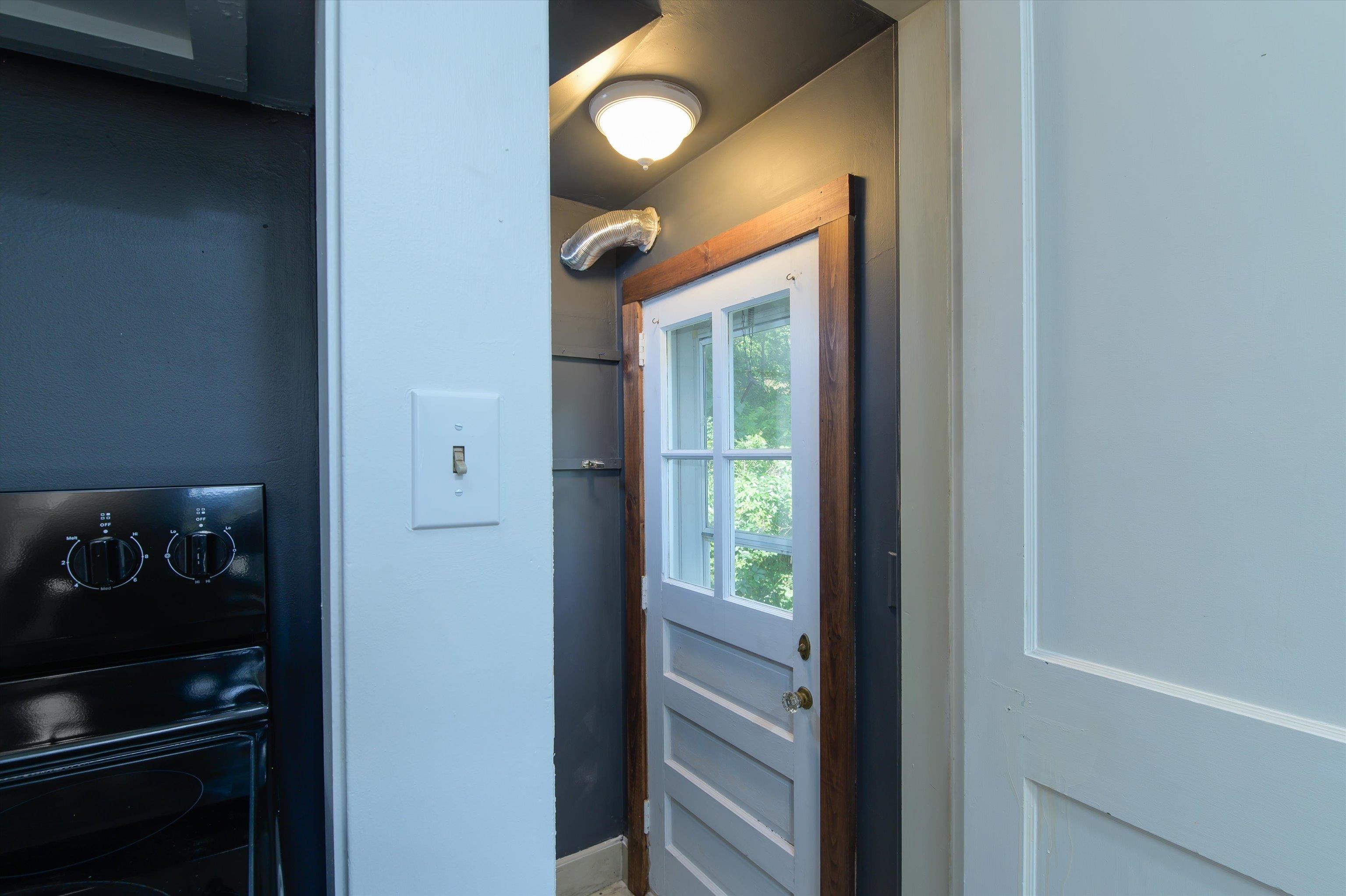 Kitchen leading to basement and side door 25961954