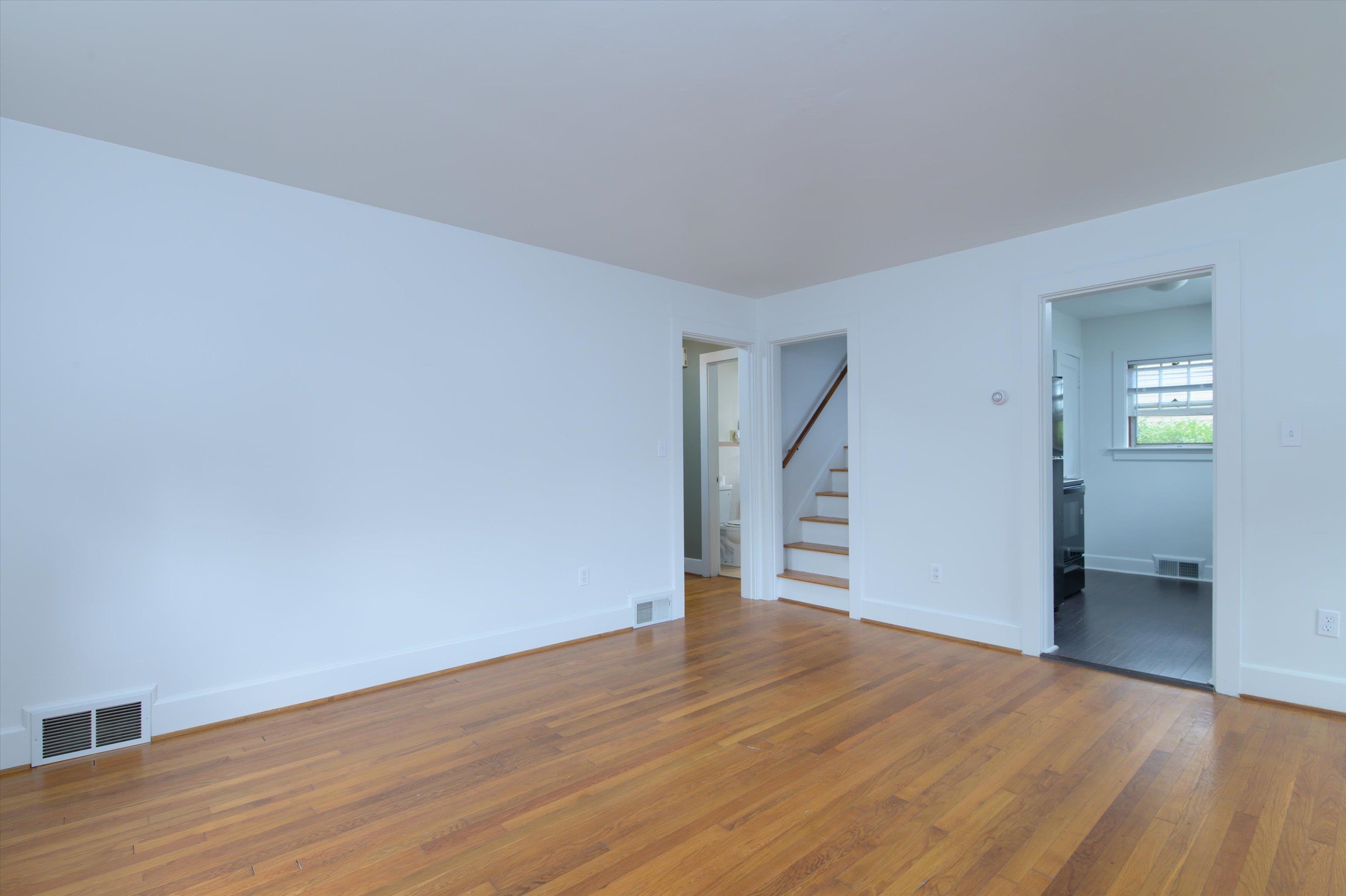 Living room with view of staircase, hall and kitchen 25961948