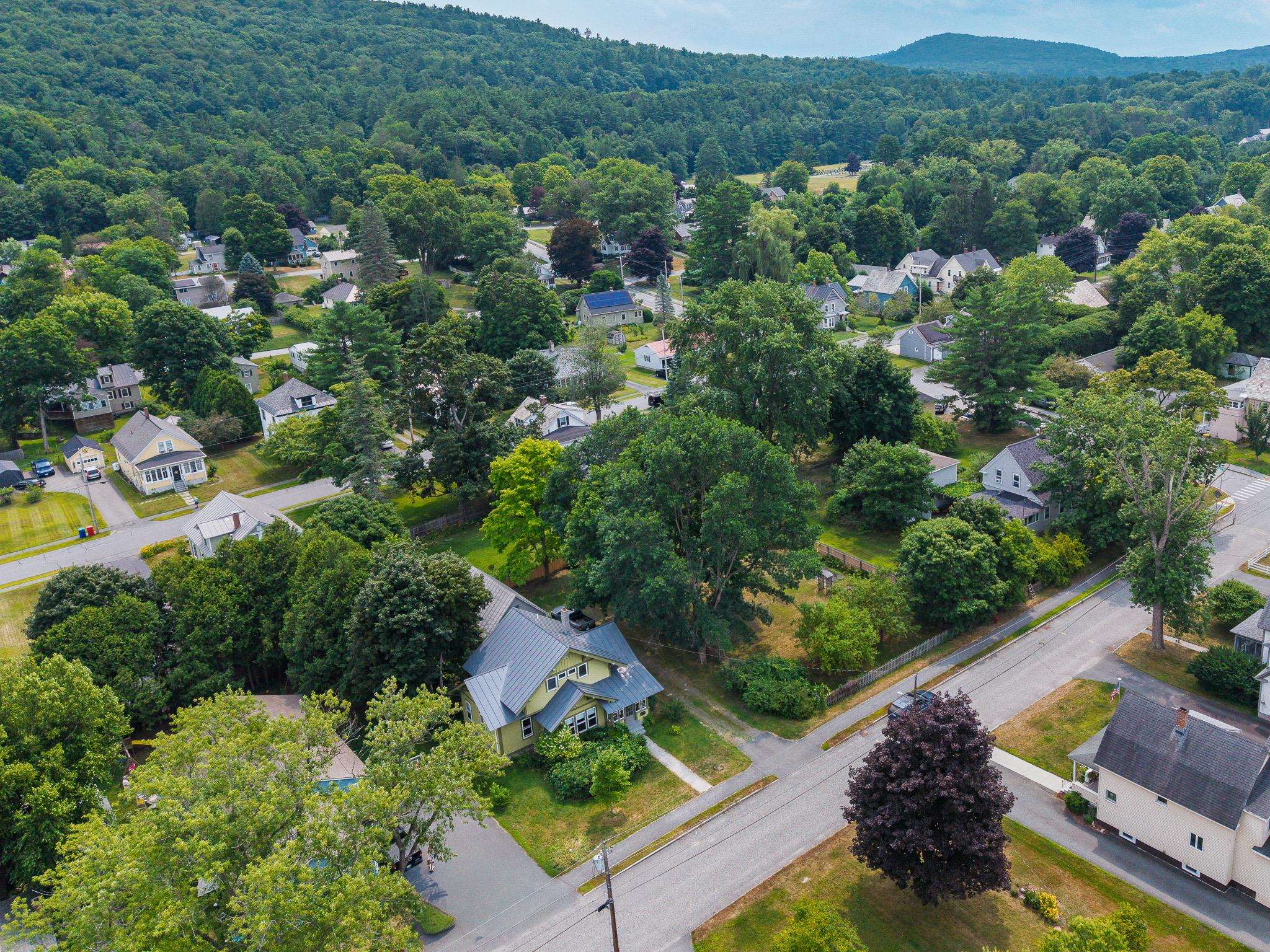 Downtown neighborhood. Walk to everything. Shows house and fenced-in yard 25911596