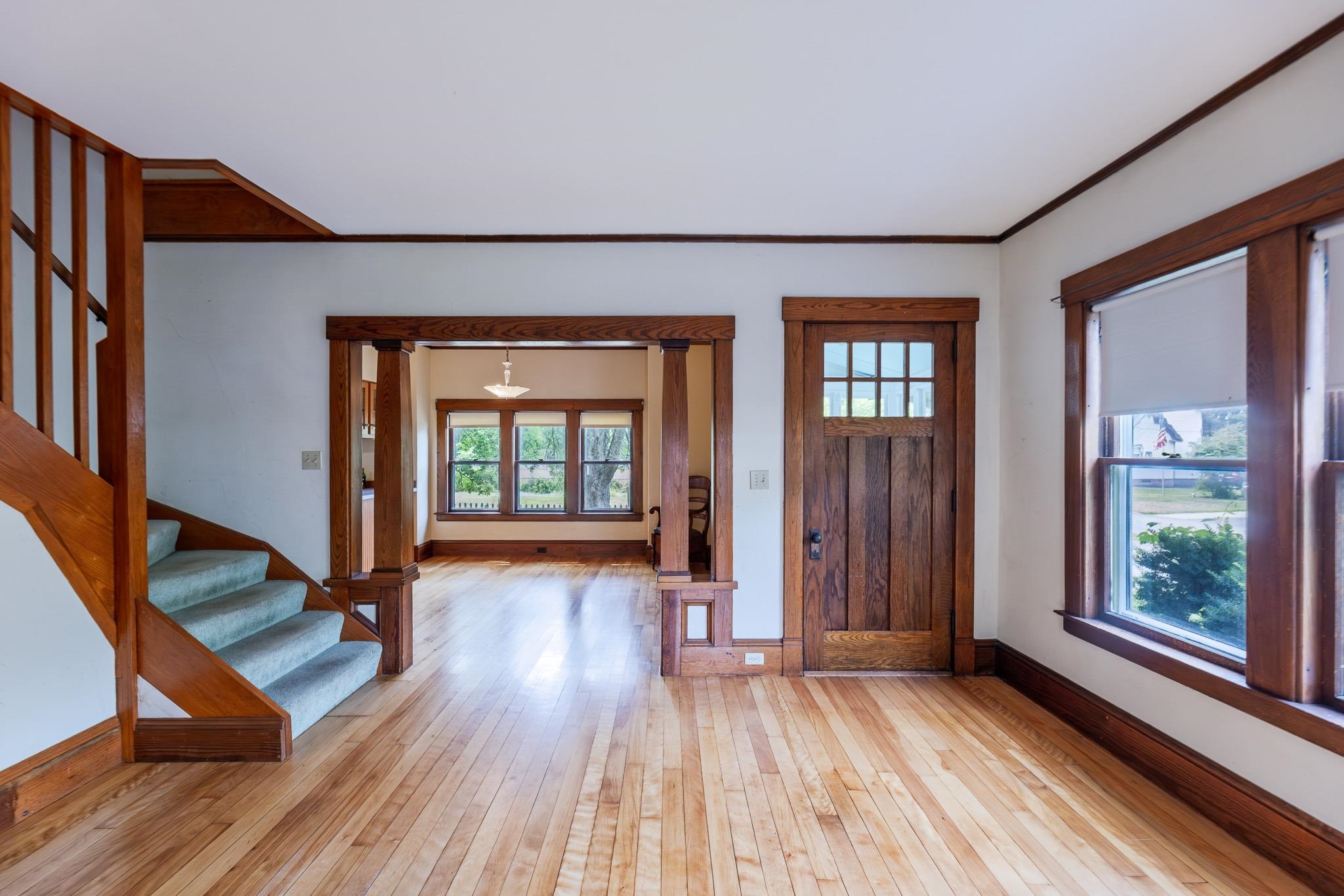 Living room showing stairs to 2nd floor & door to porch 25911428
