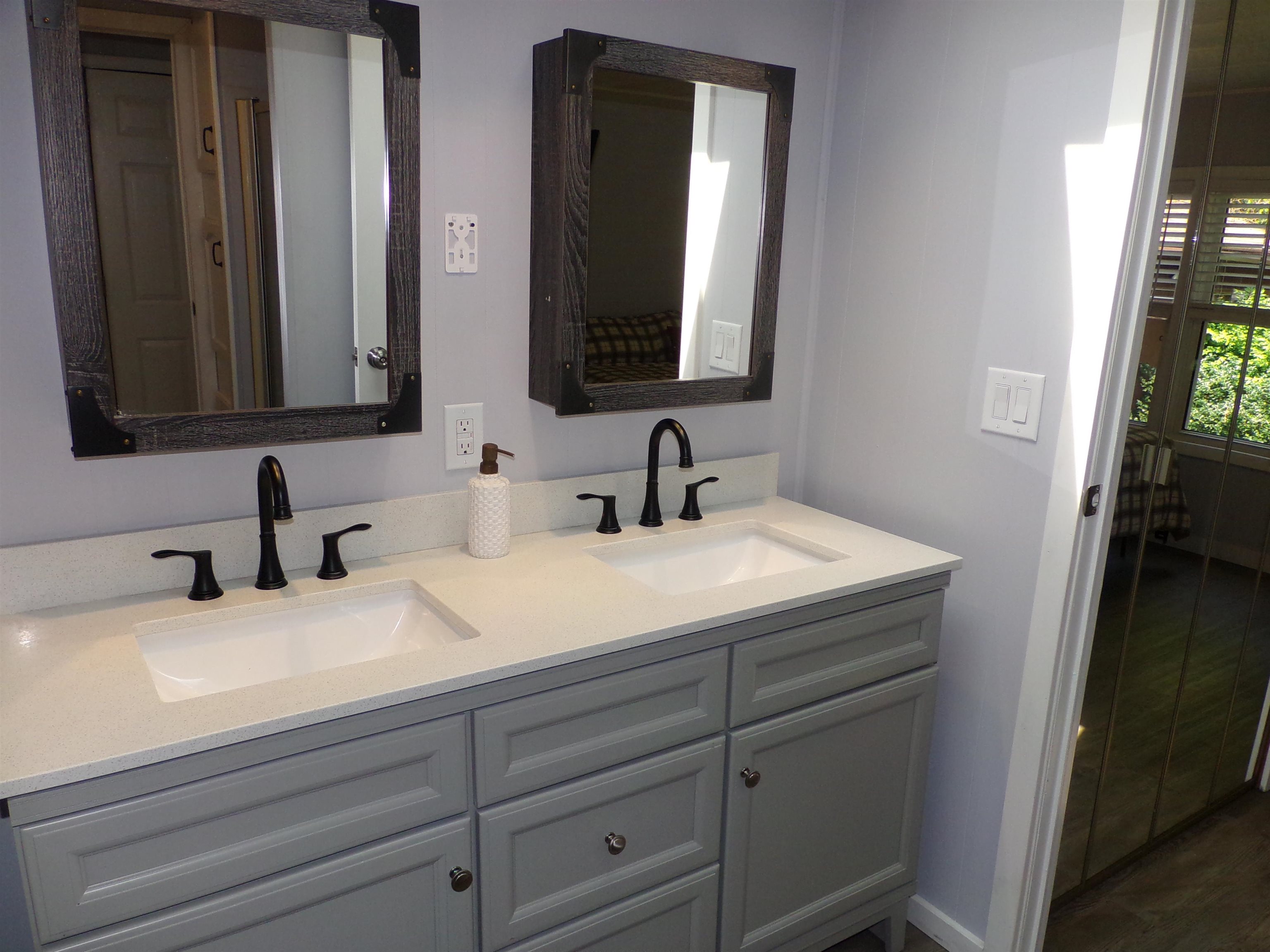Double vanity and shower in bath
