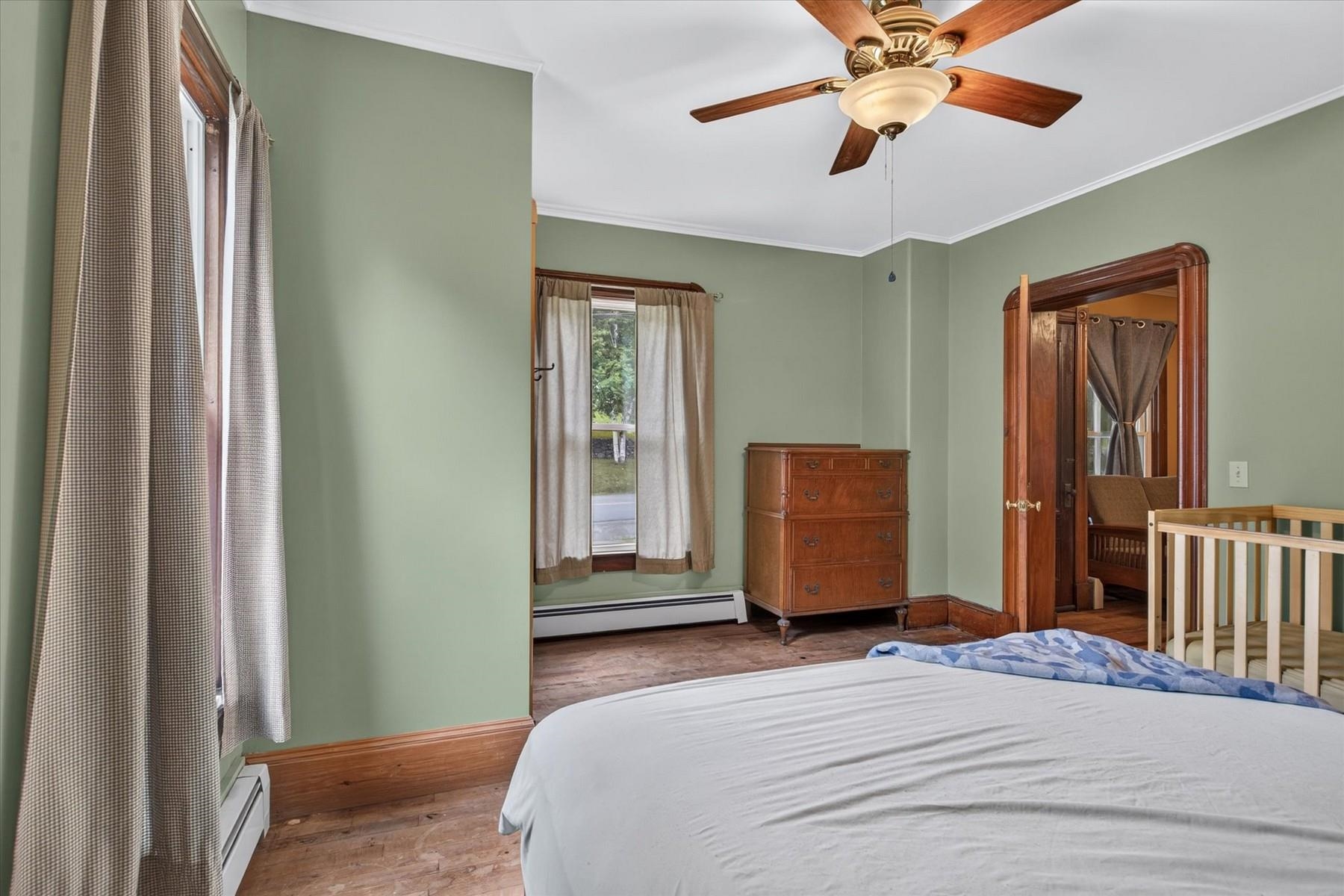 Unit 1 Bedroom with ceiling fan.