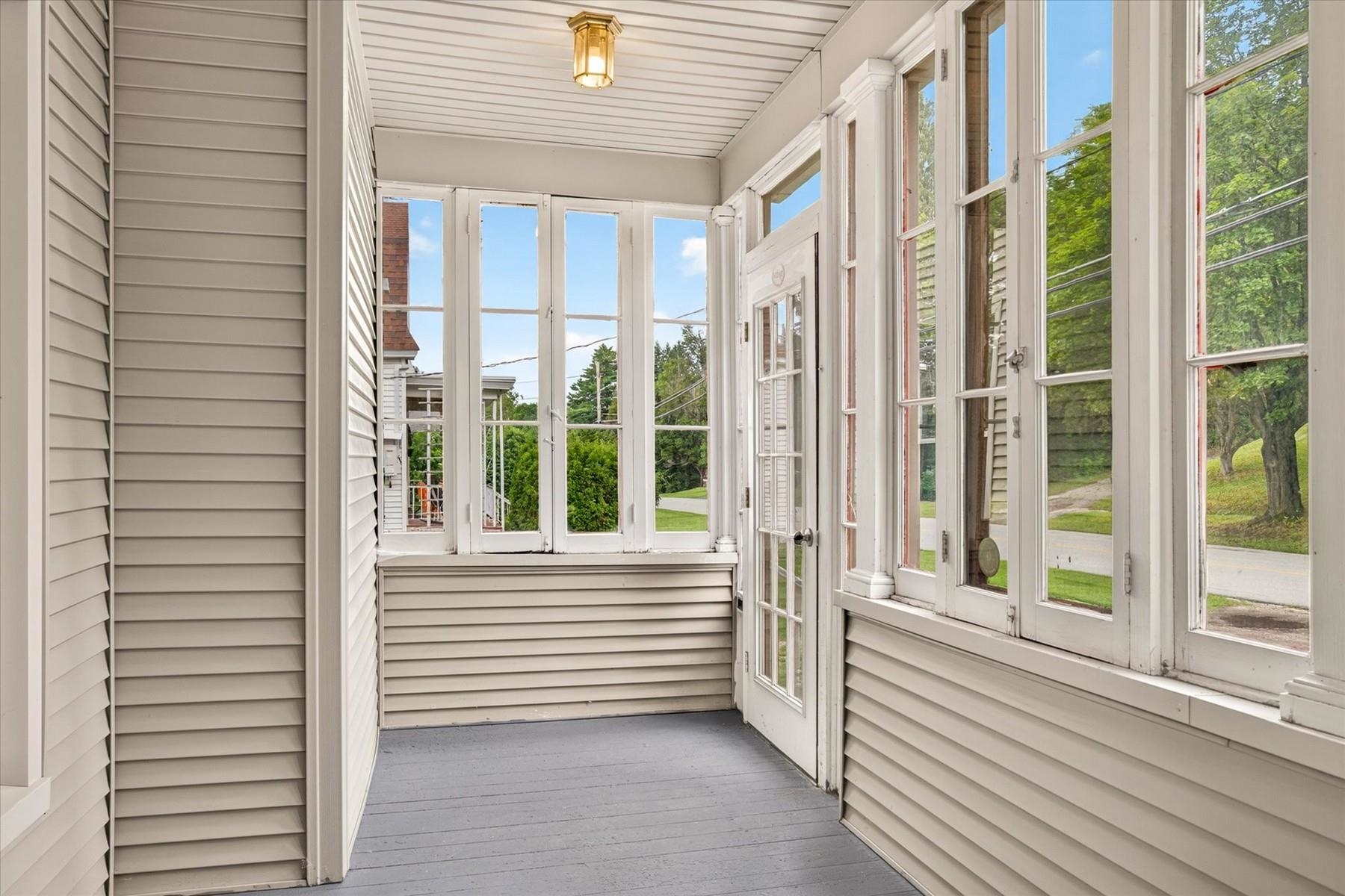 Enclosed front porch.