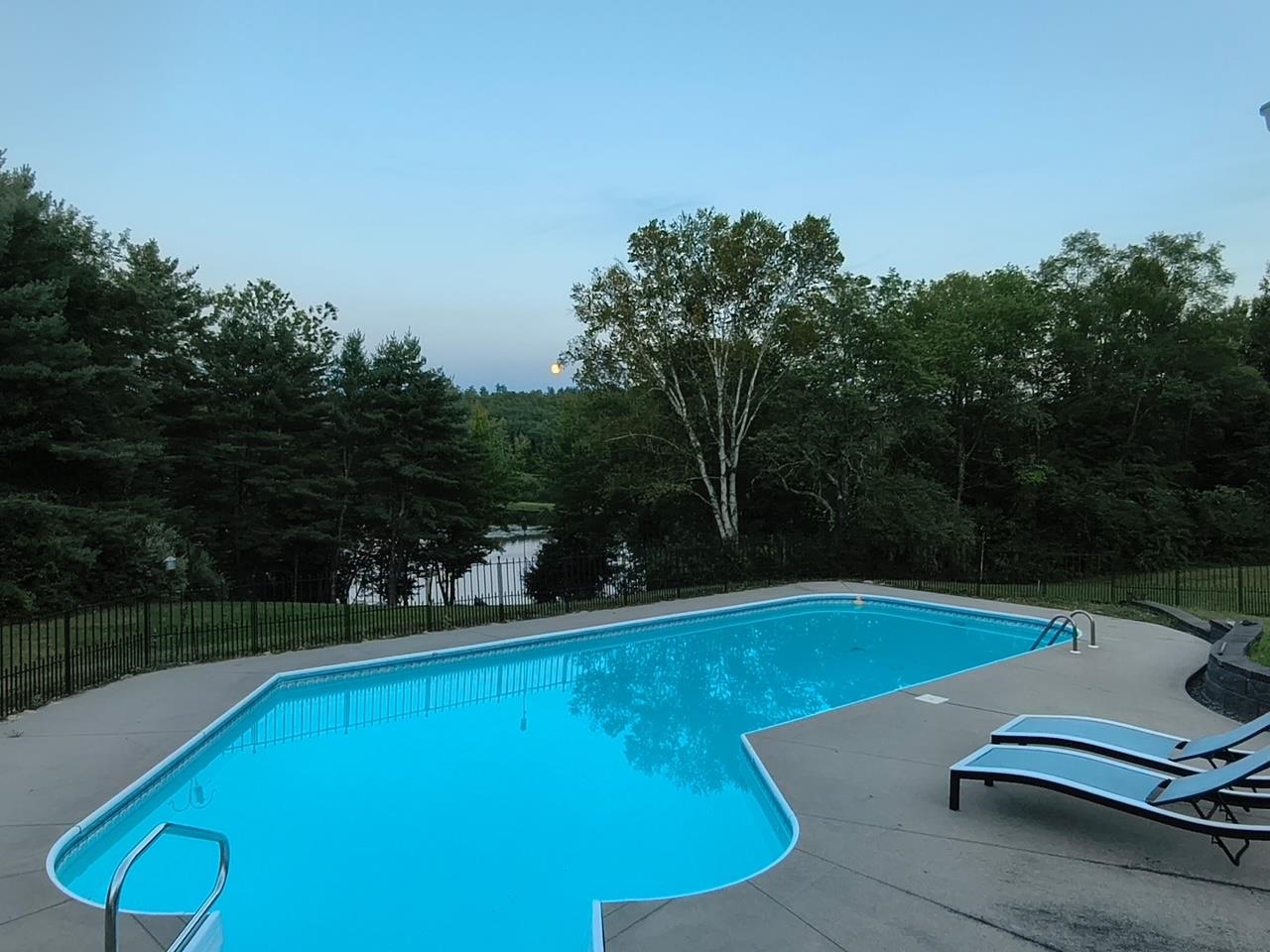View from deck overlooking pool and river