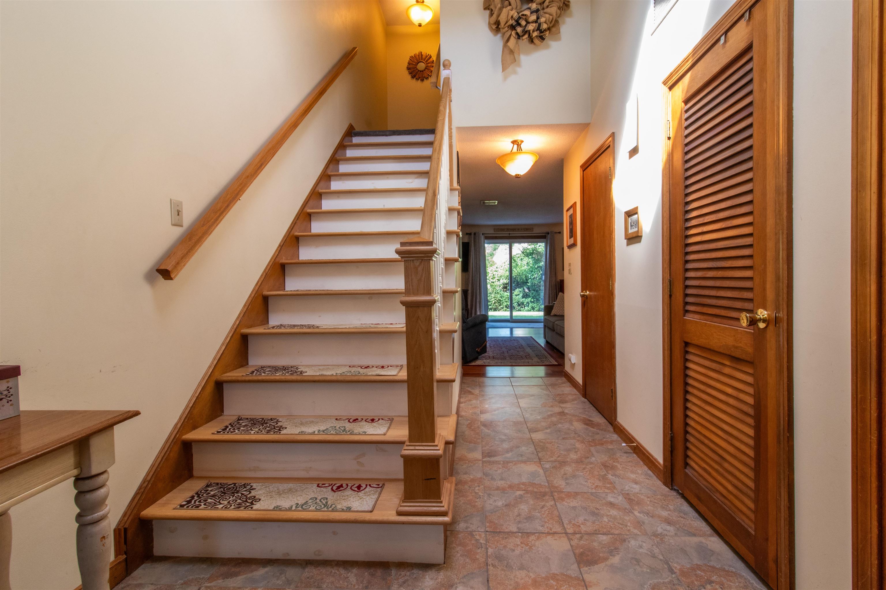 foyer with new oak stairs and banisters