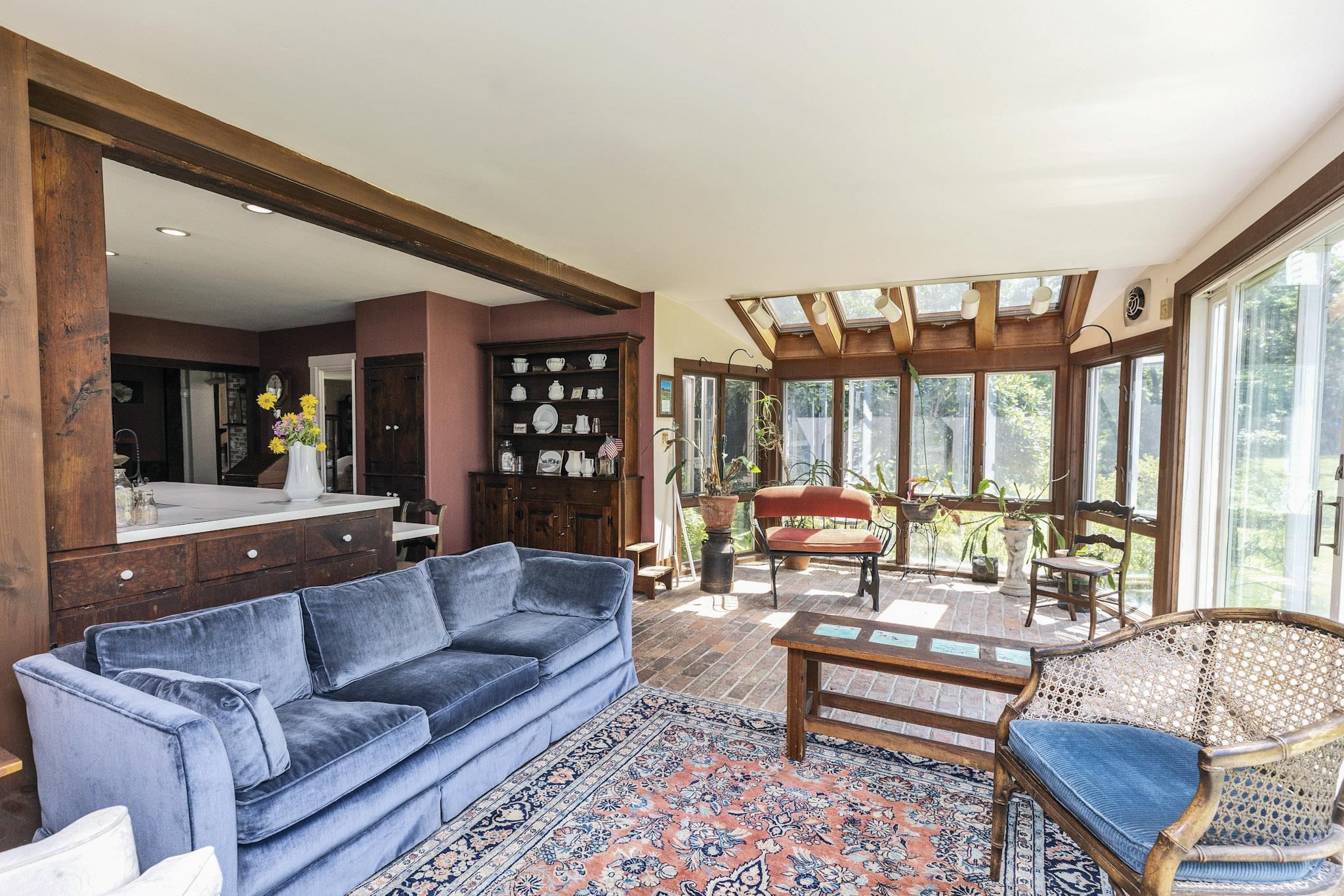 Kitchen is open to sunroom