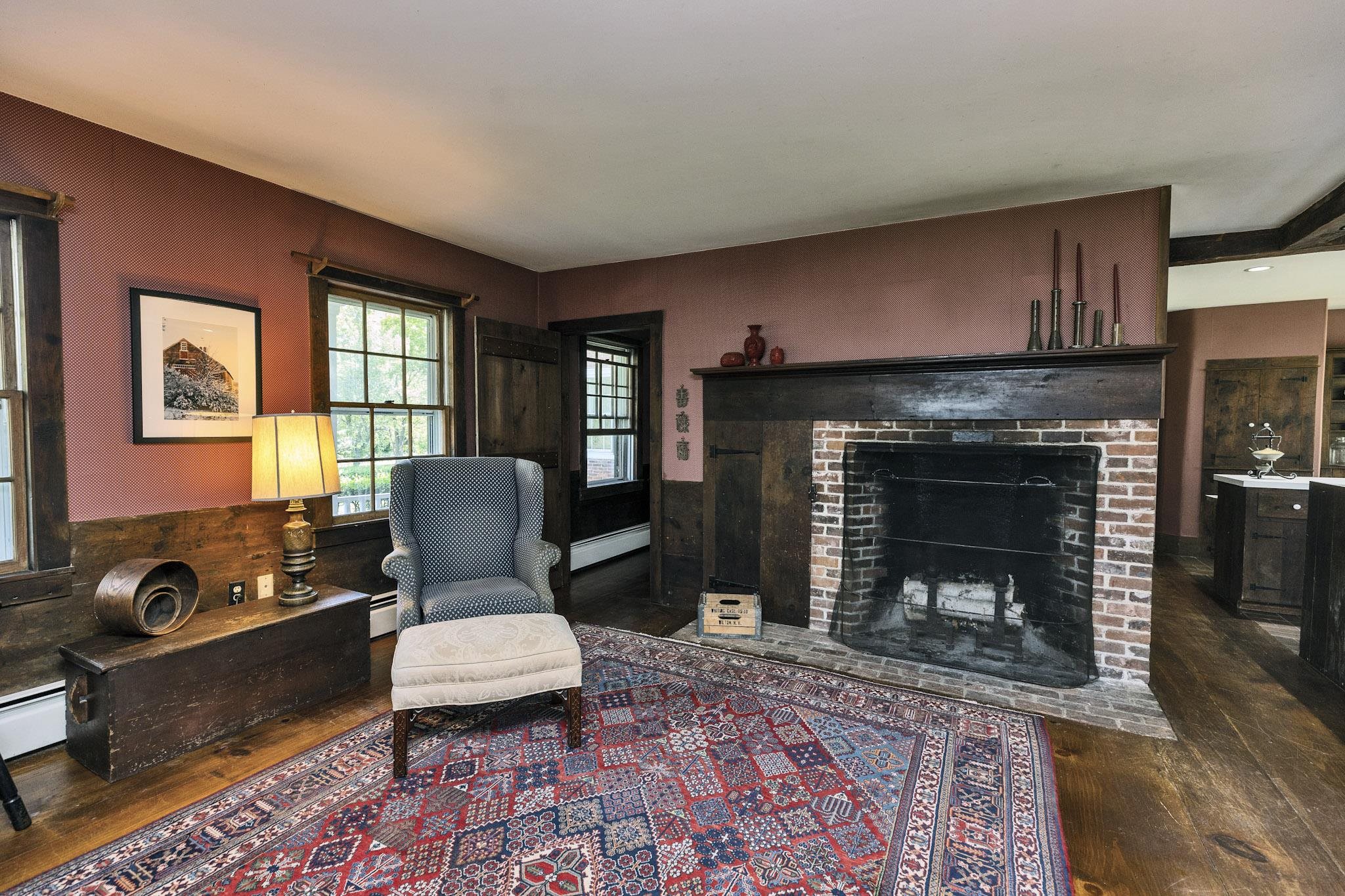 Family room with keeping room fireplace and woodstove flue