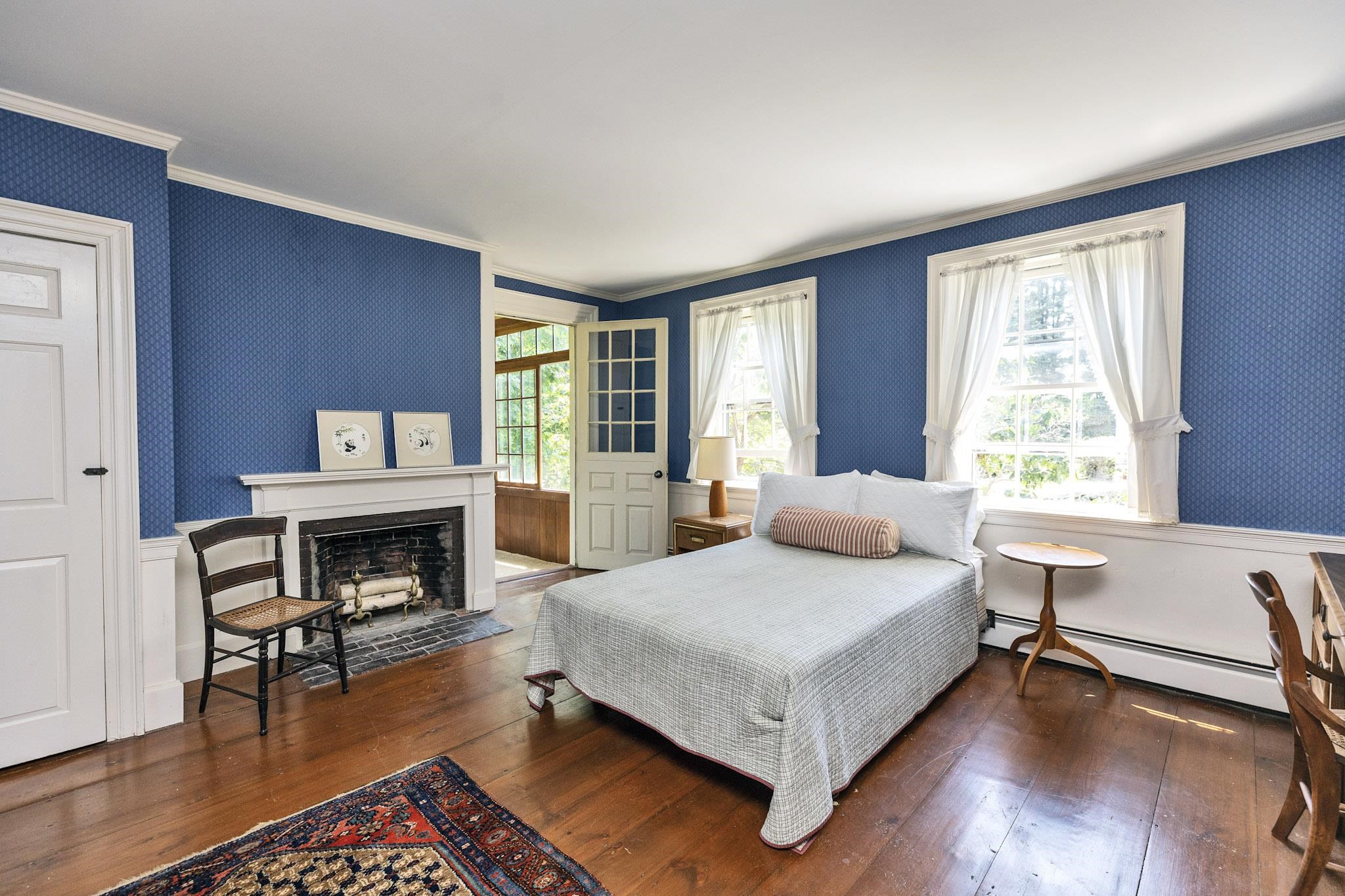 Back fireplaced bedroom with porch access
