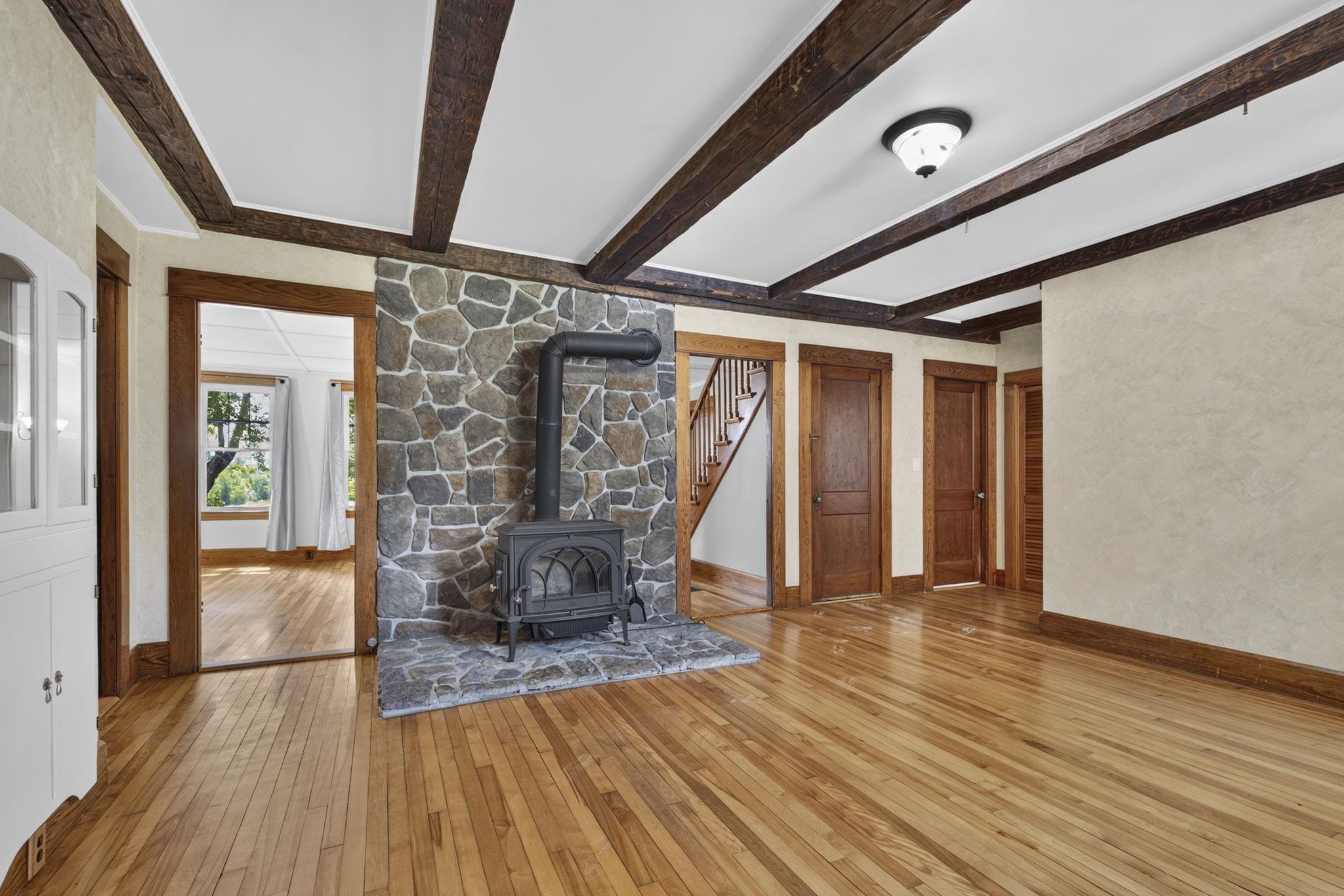 Decorative wood burning stove with stone hearth 26017595