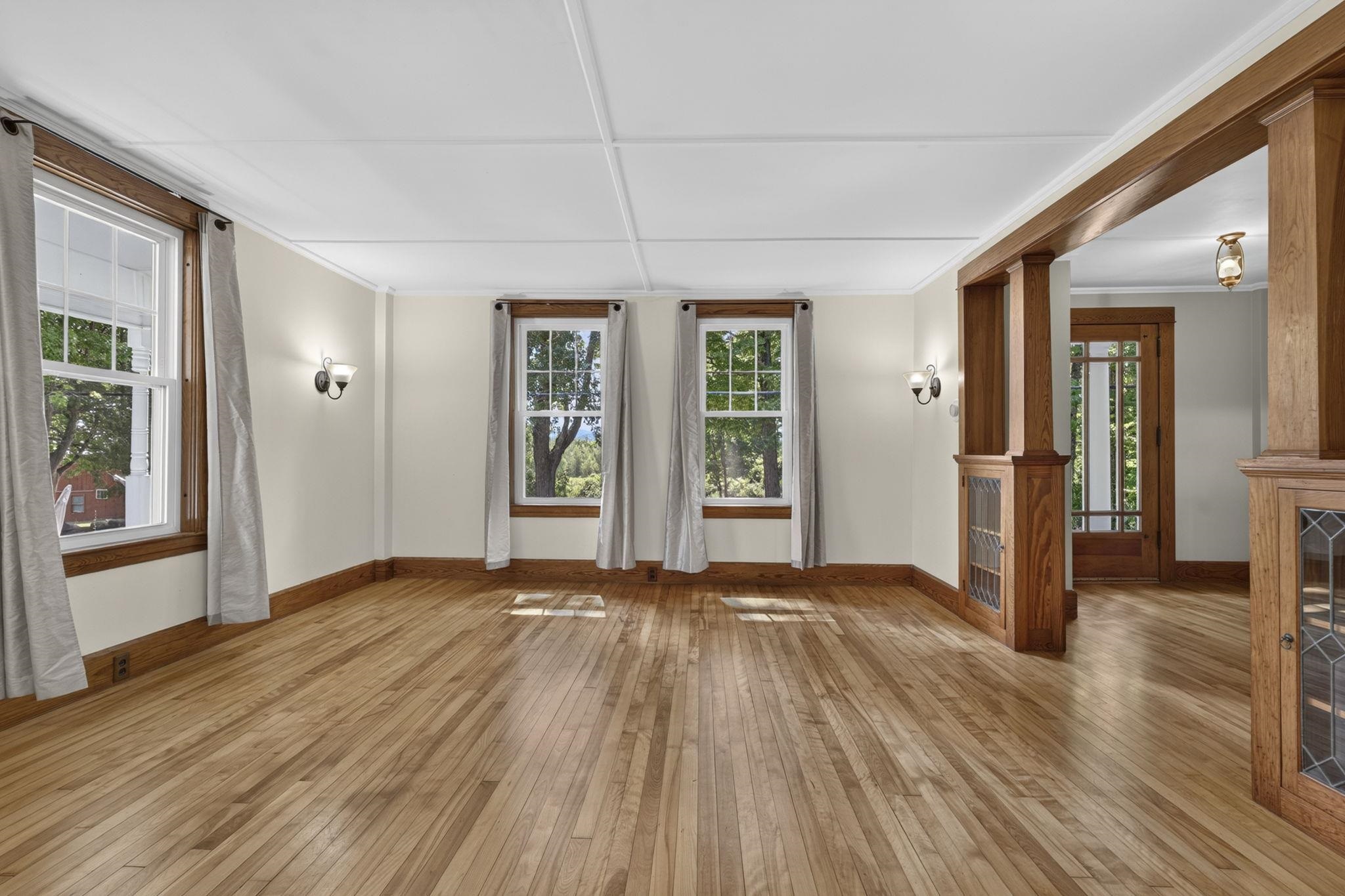 Front room with hardwood flooring 1st floor 26017587