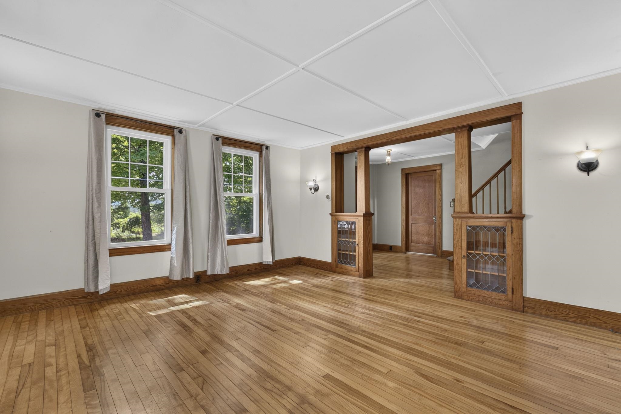 Front room with hardwood flooring 1st floor 26017586