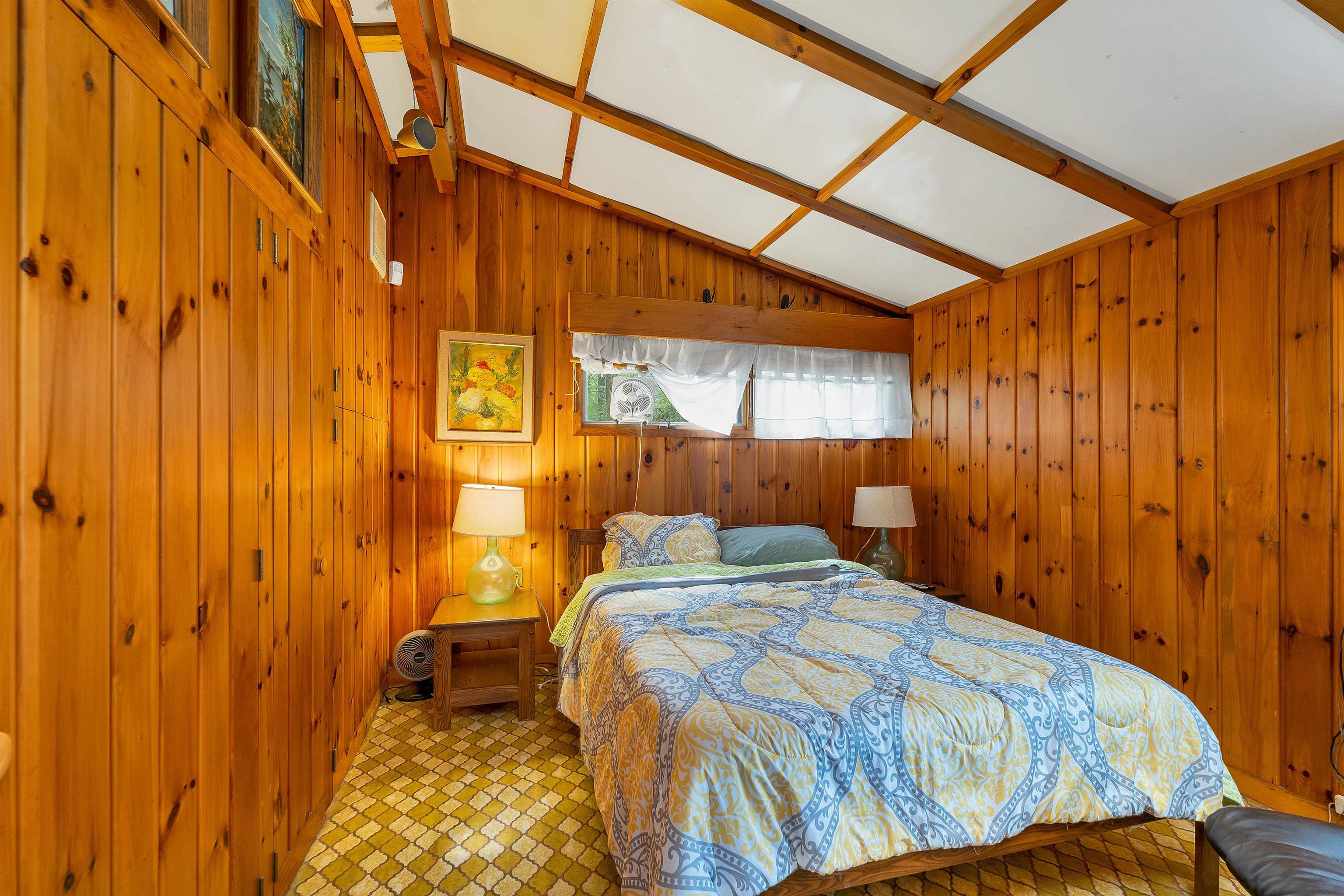 THERE ARE THREE BEDROOMS.  THE PRIMARY IS SET ON THE LAKE SIDE OF THE HOUSE.
