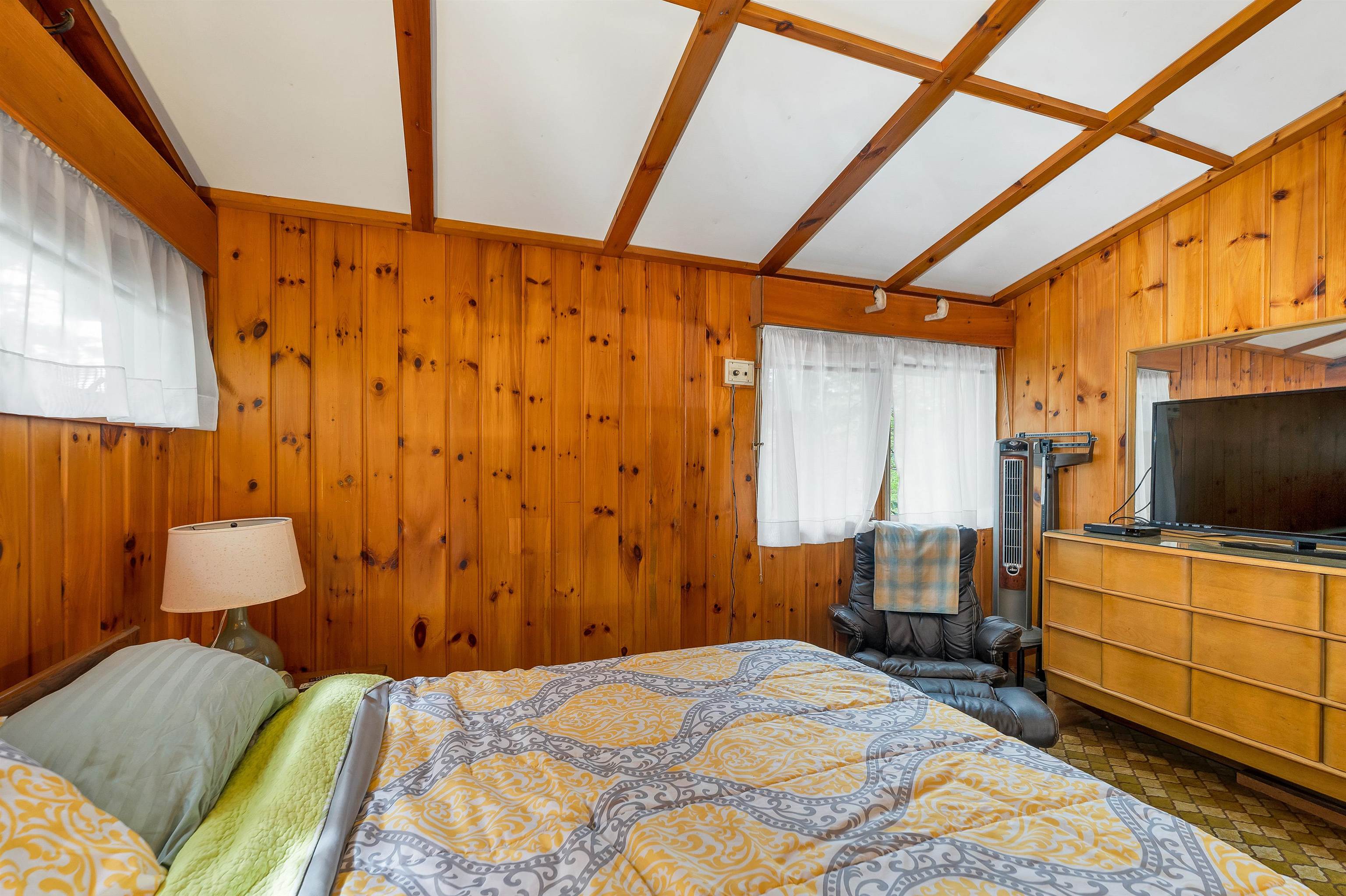 THE CEILINGS ARE VAULTED.  THERE ARE MANY CLOSETS AND STORAGE SPACES IN EACH ROOM.