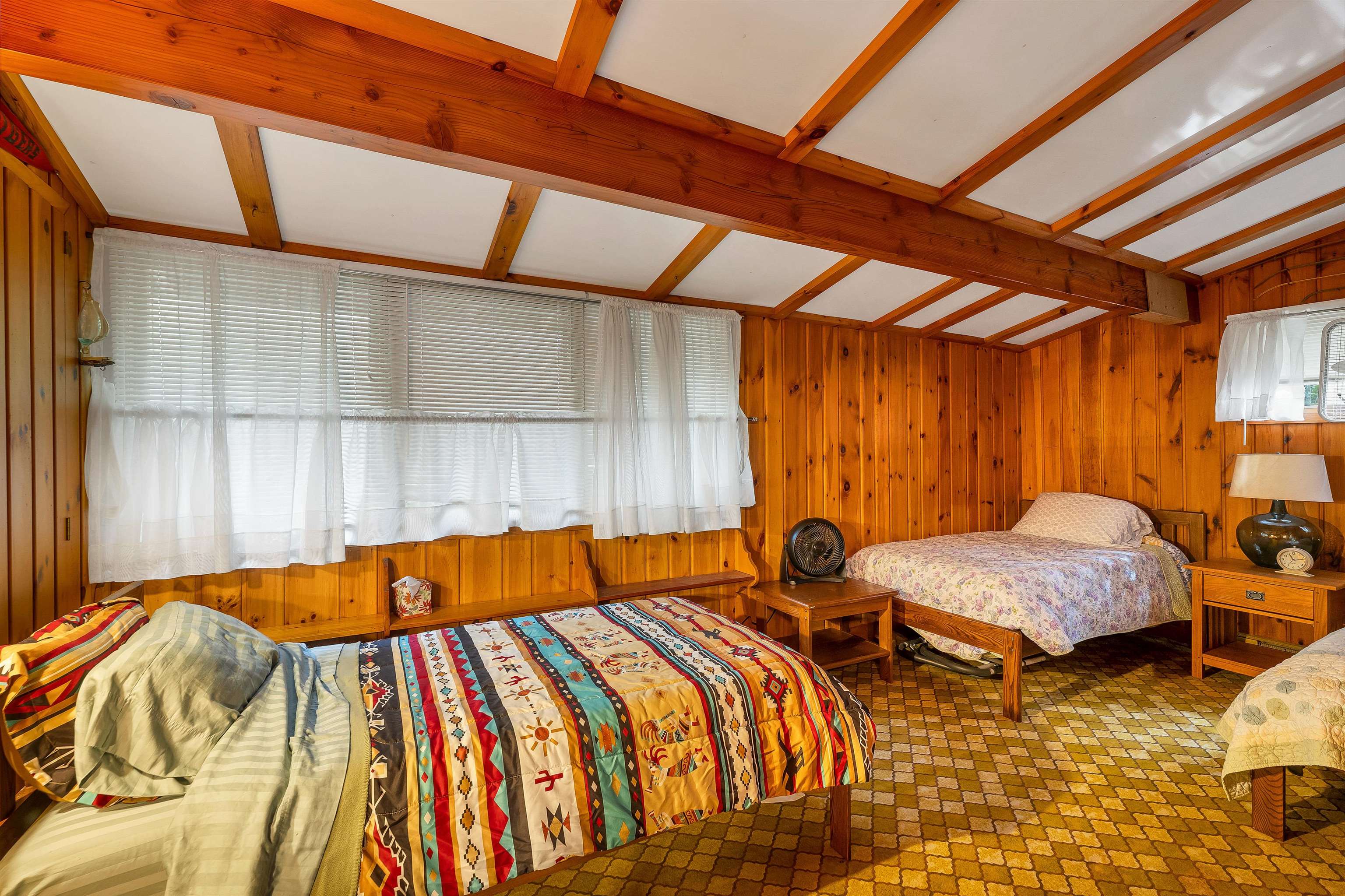 THE SECOND BEDROOM IS LIKE A SMALL DORM.  PRESENTLY, THERE ARE THREE BEDS AND BUREAUS IN THIS ROOM.