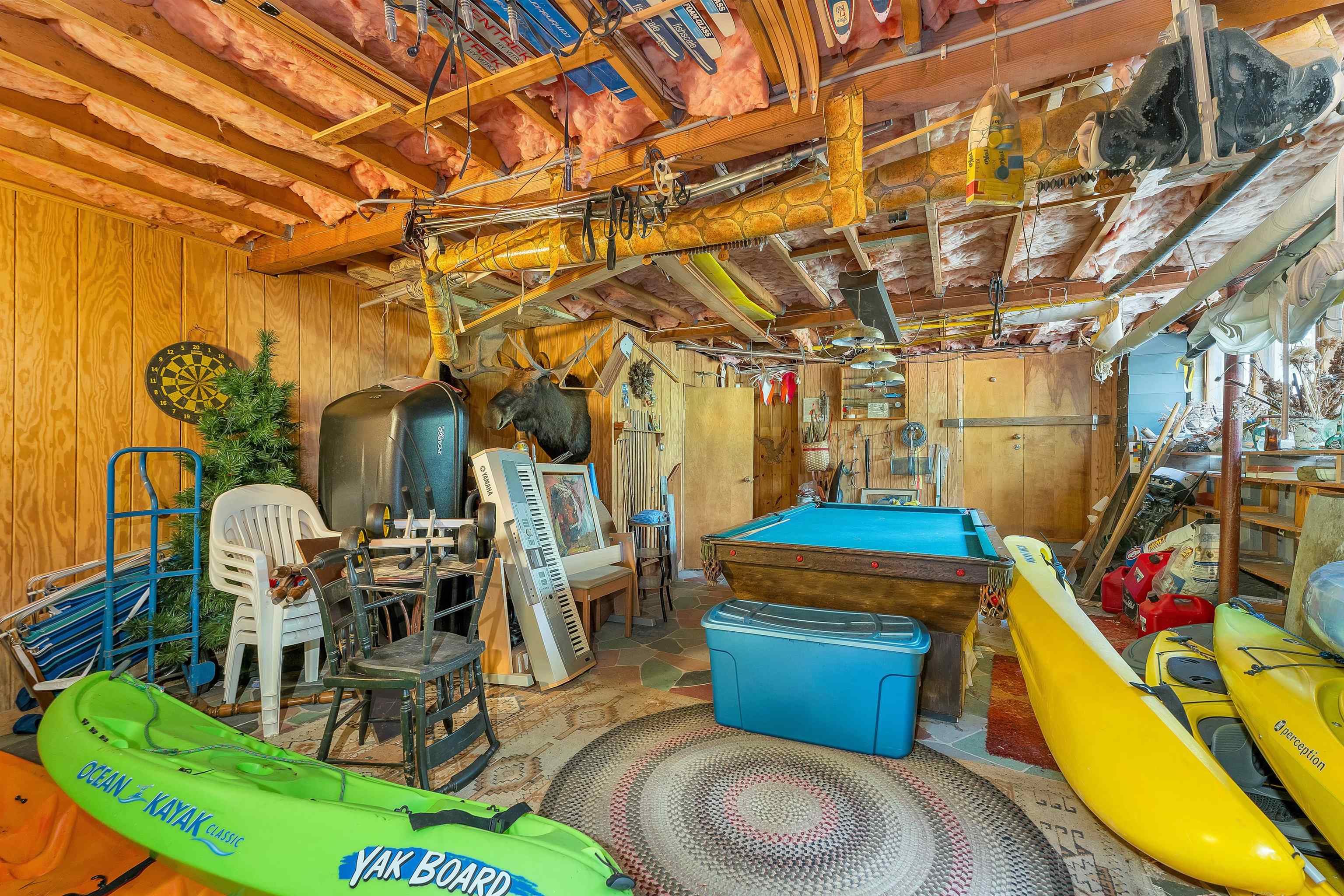 DOWN THE STAIRS IN THE LIVING ROOM IS THE FAMILY/BILLIARDS ROOM.
