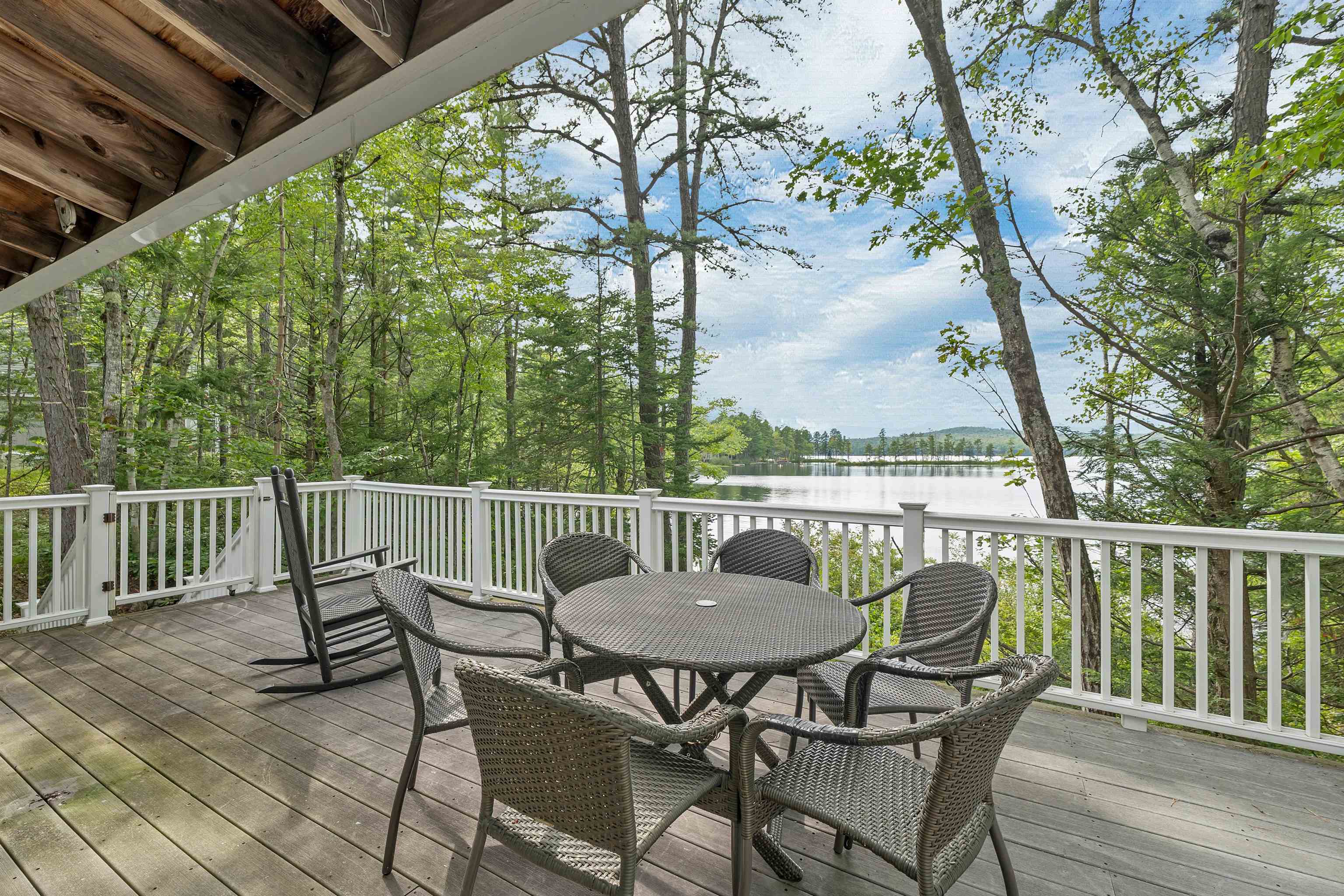EXTRA WIDE AND ON TWO SIDES OF THE HOUSE, THE DECK IS PERFECT TO ENJOY OUTSIDE LIVING.