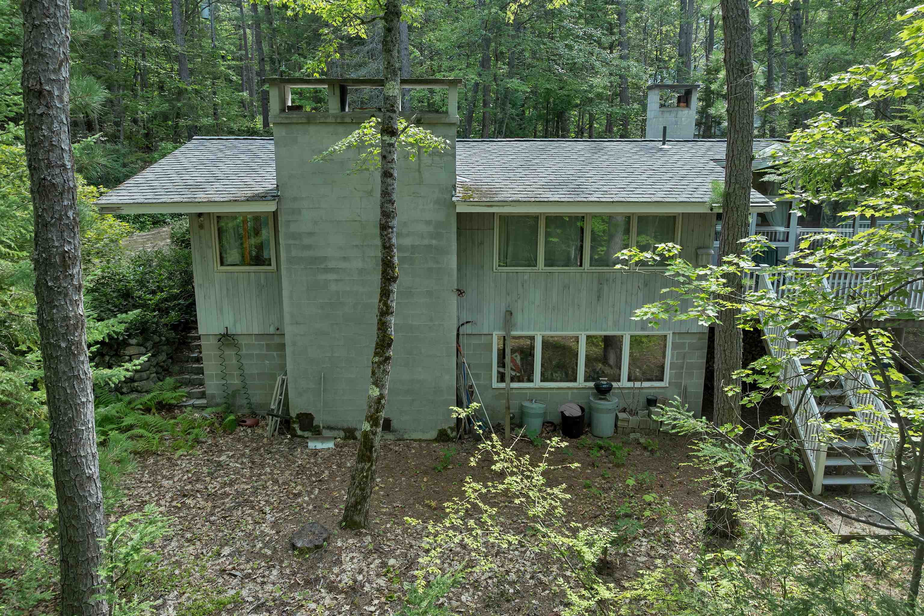 IT IS VERY WELL BUILT WITH CONCRETE BLOCK FOUNDATION AND CHIMNEYS.
