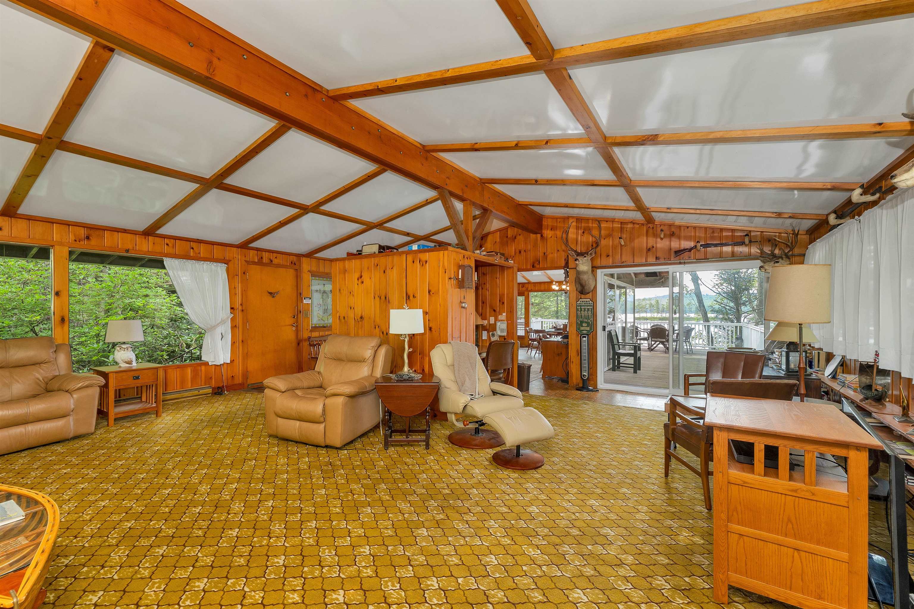 THE LIVING AREA HAS LARGE WINDOWS WHICH ARE ORIGINAL TO THE HOUSE.