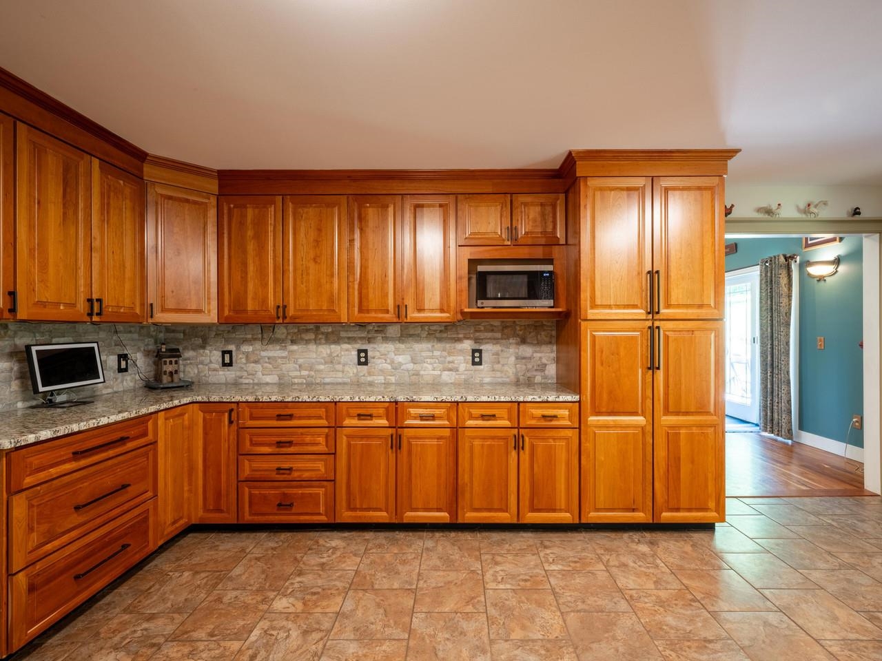 Cherry cabinets & tile floors