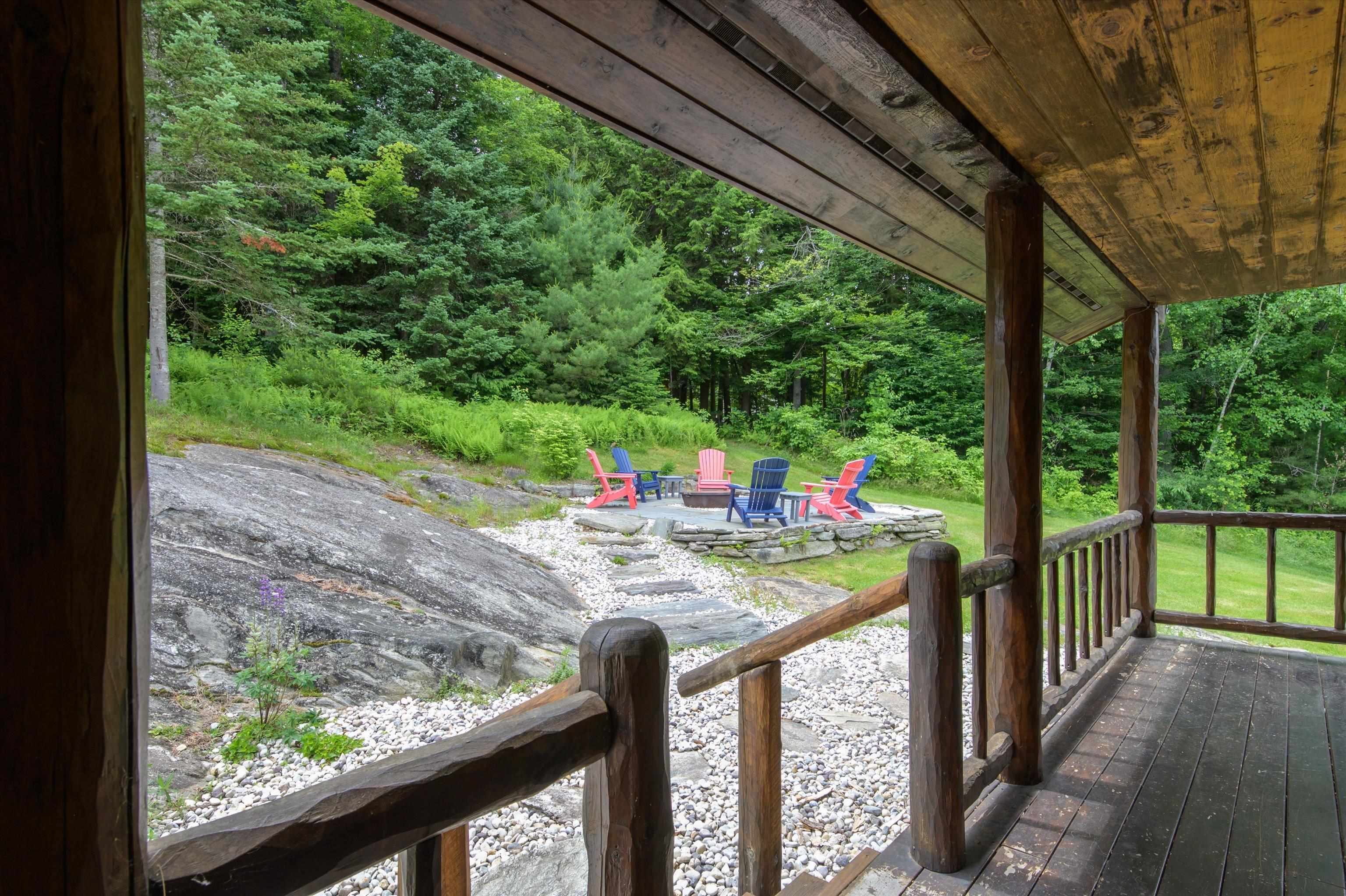 Covered back porch with access to patio/firepit...
