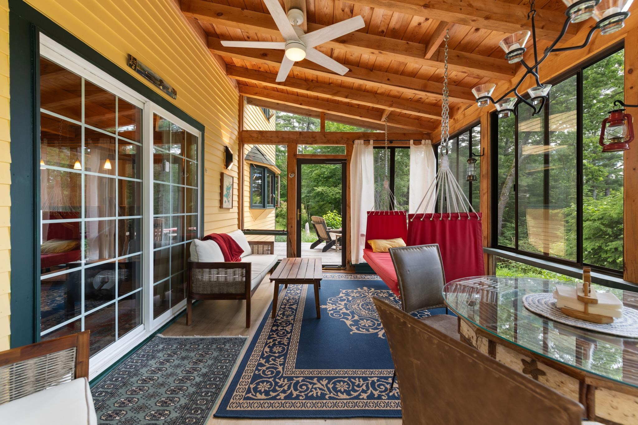 This screened end porch is the perfect place for your coffee in the morning