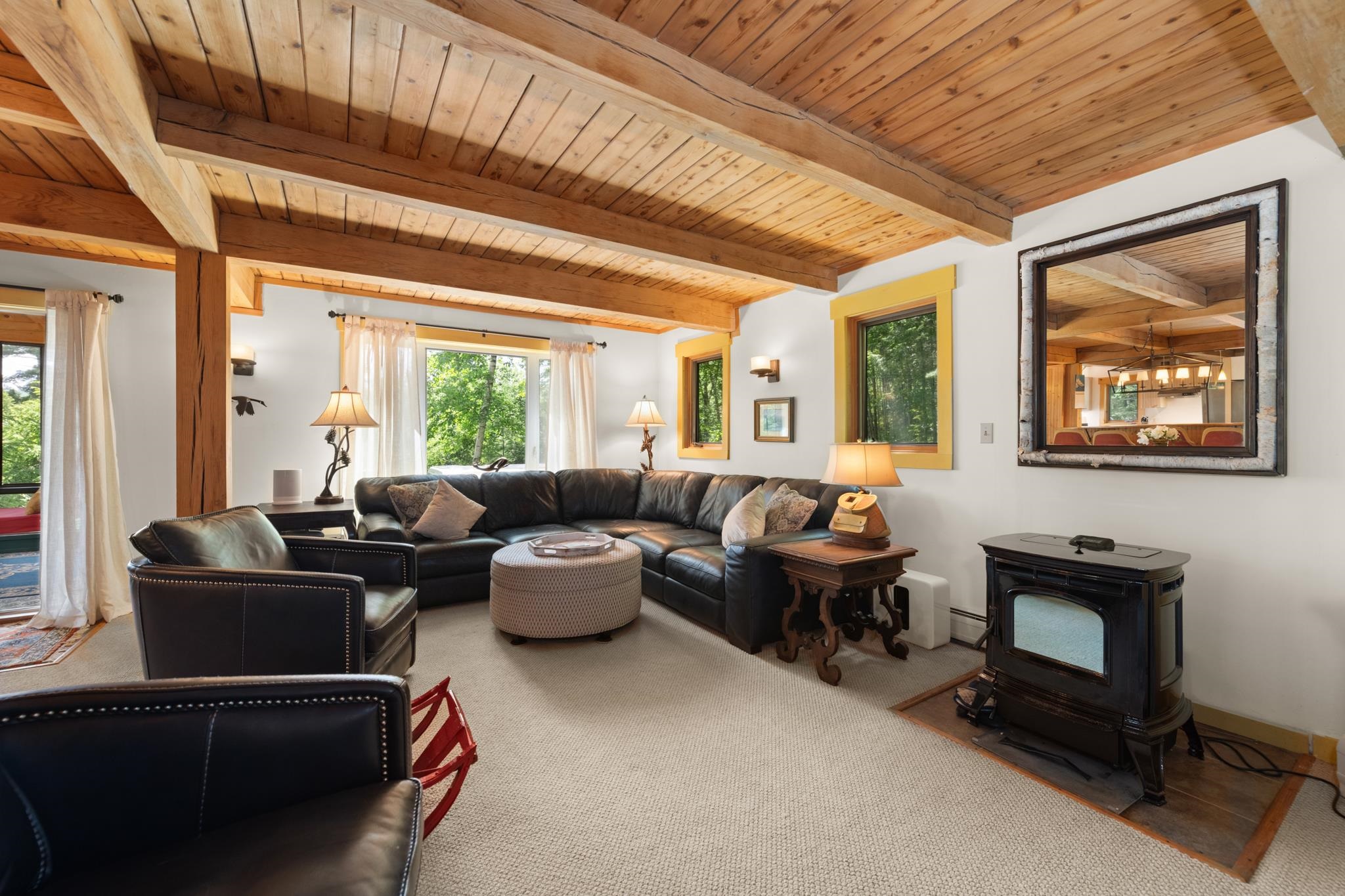 This cozy living room has a gas wood stove for those chilly nights