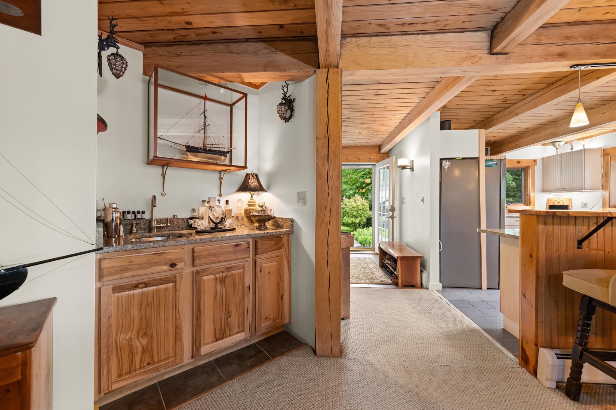 The wet bar right between the kitchen and living room is great for wiping up the perfect cocktail!