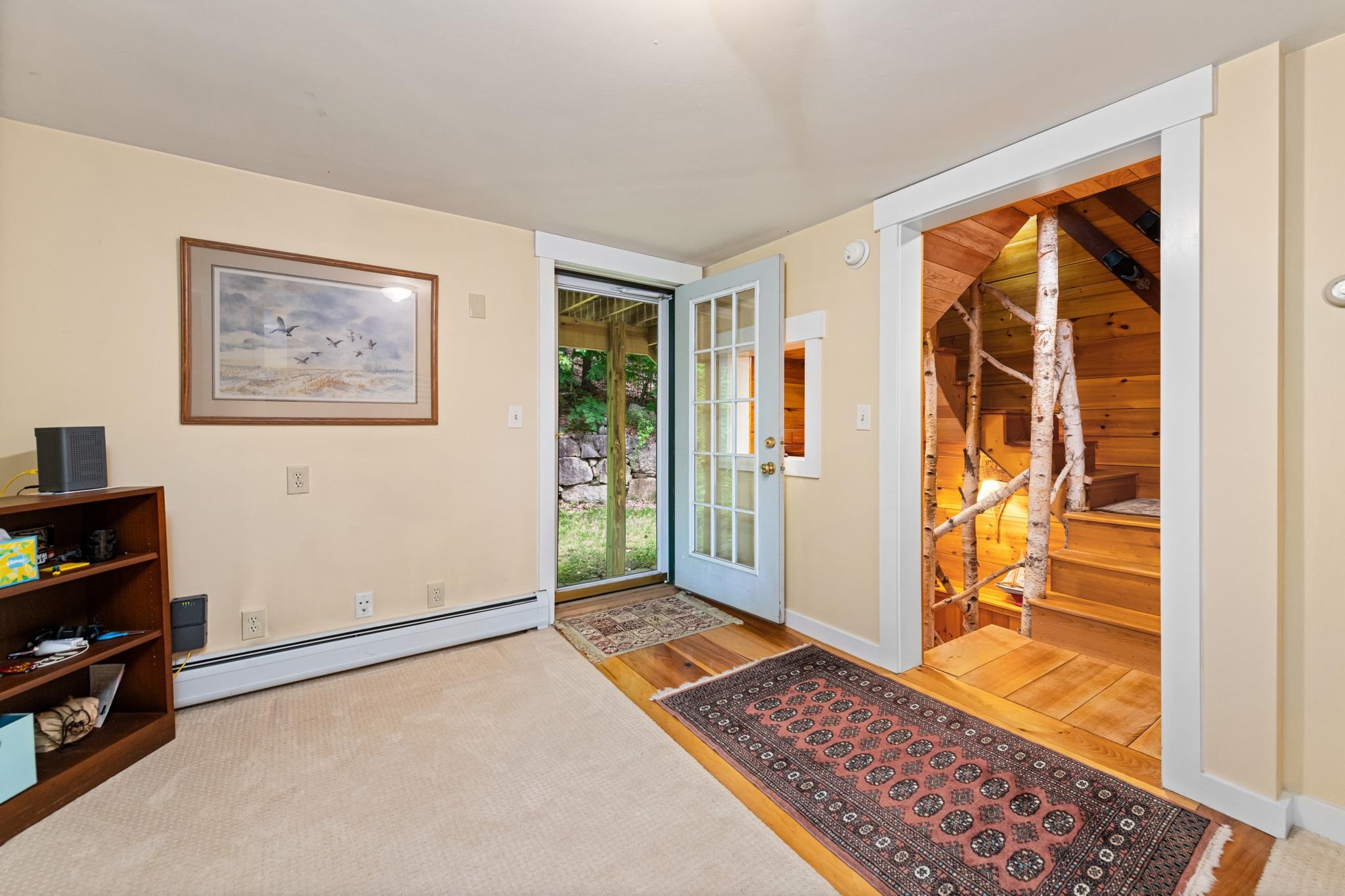 The landing on the second floor that features 3 bedrooms and a full bathroom and laundry