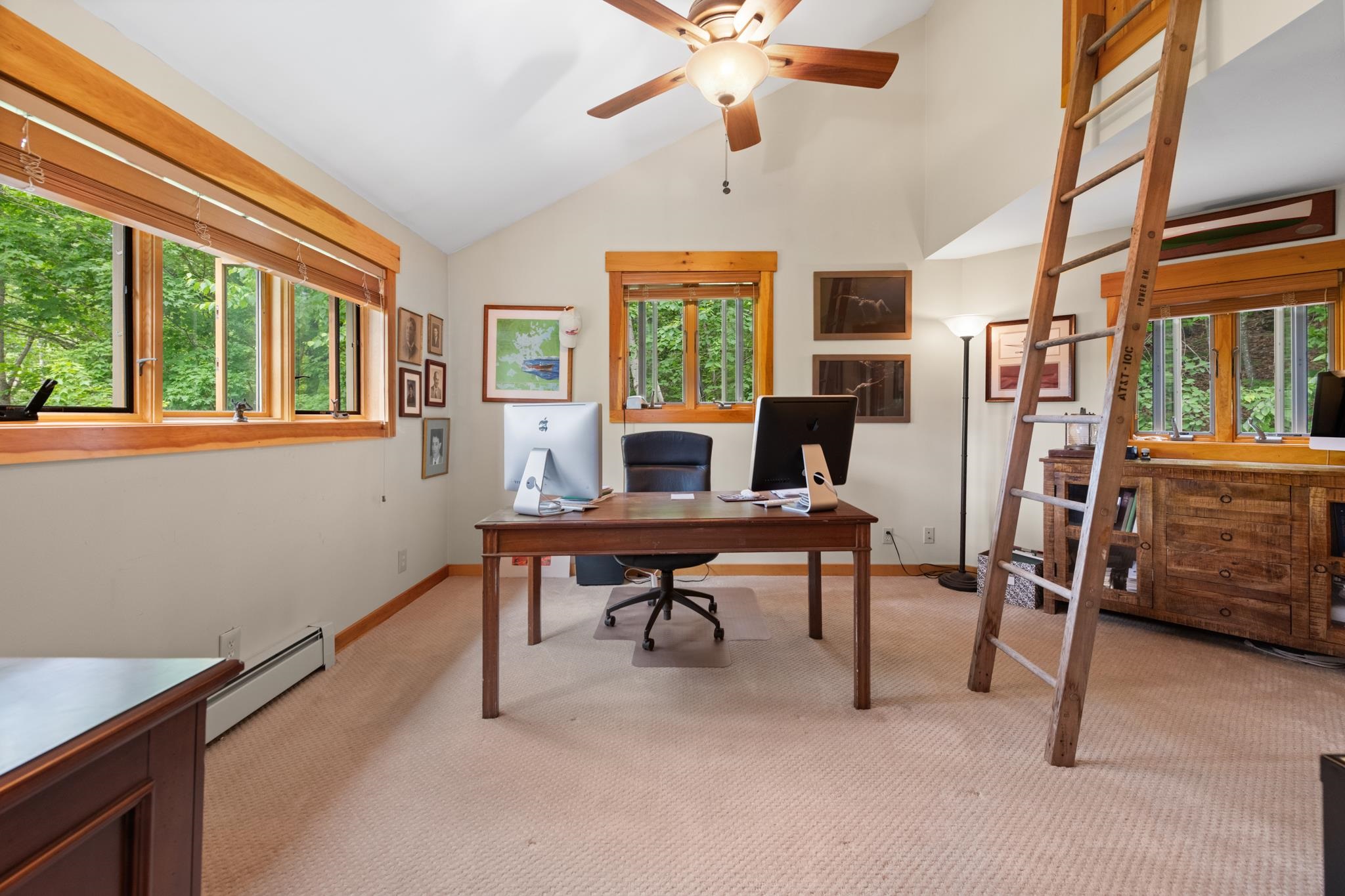 The primary suite features a private office