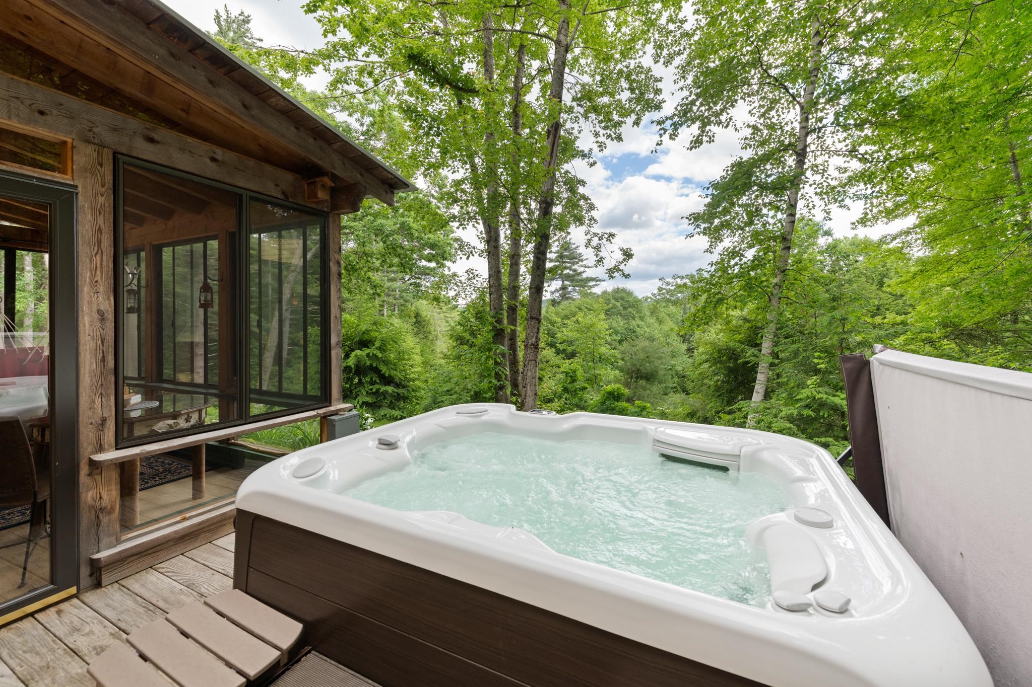 Then you have your hot tub tucked off the screened in porch