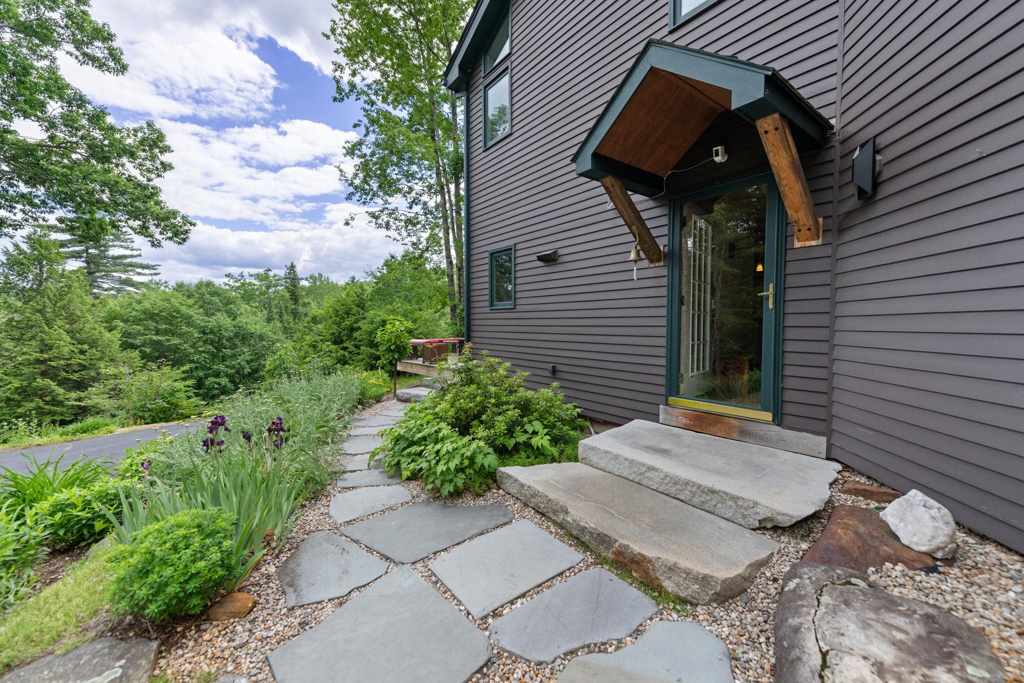 Granite and stone steps lead you to this spectacular home