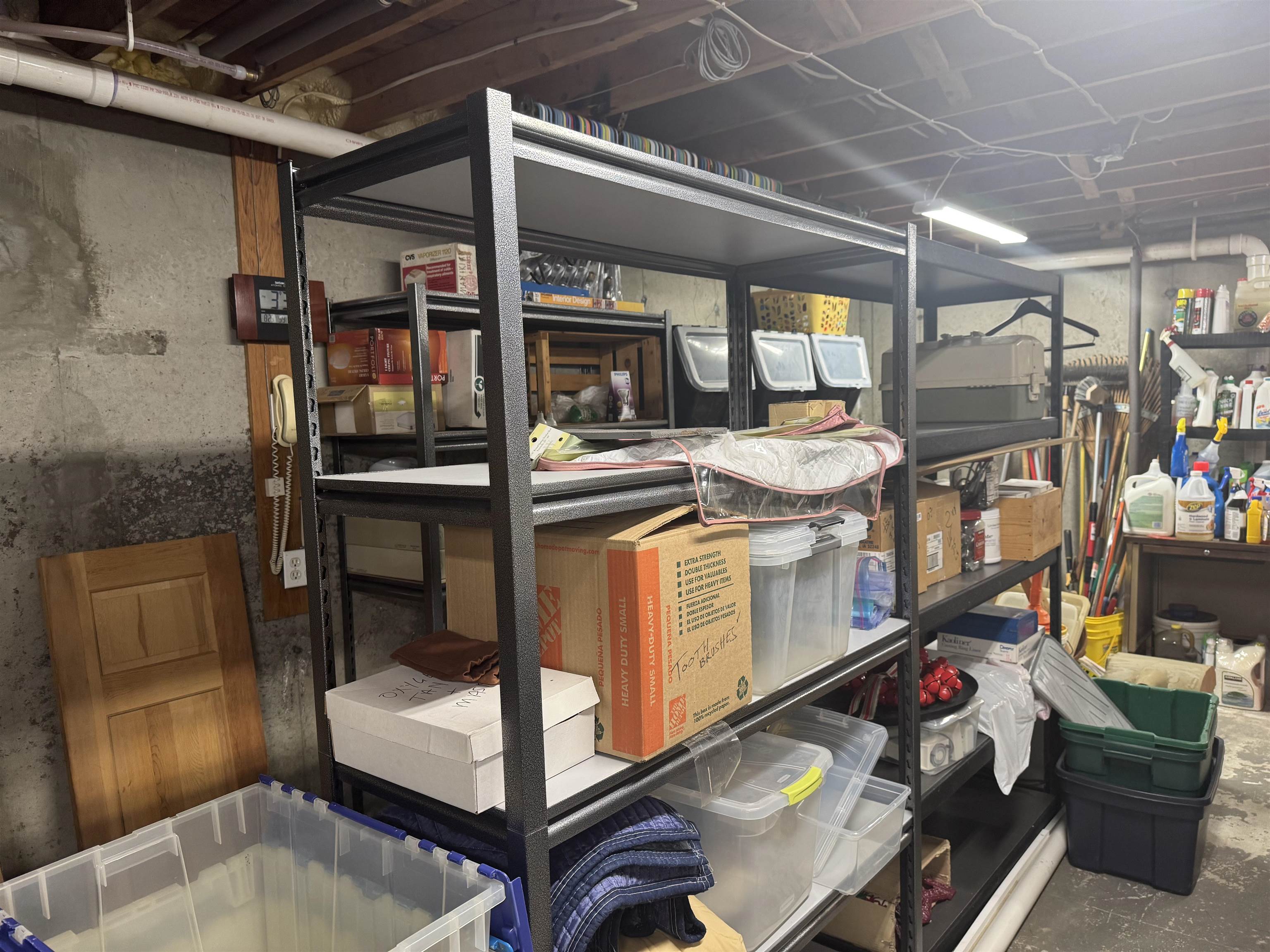 Storage area in the unfinished basement under Great rm