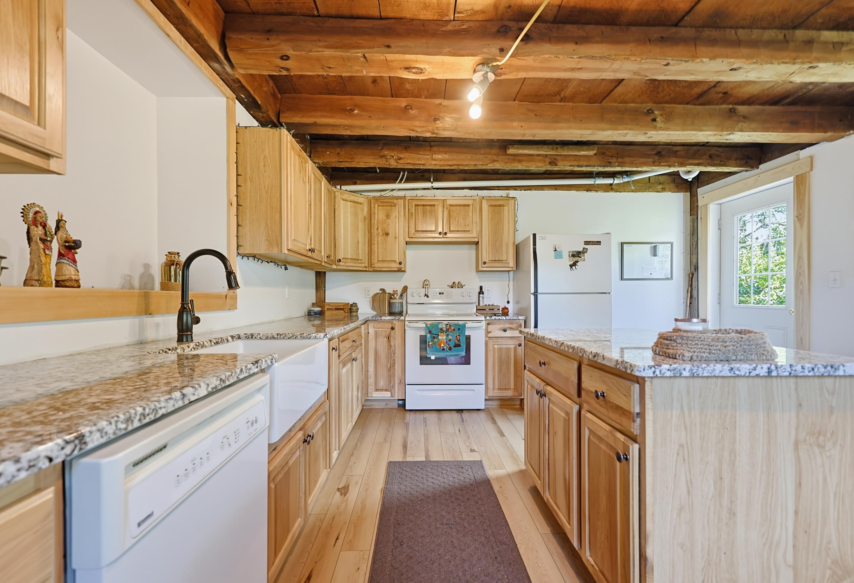 Knotty pine cabinetry with granite counters