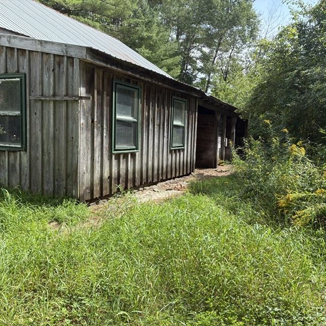 Open sheds on side of barn
