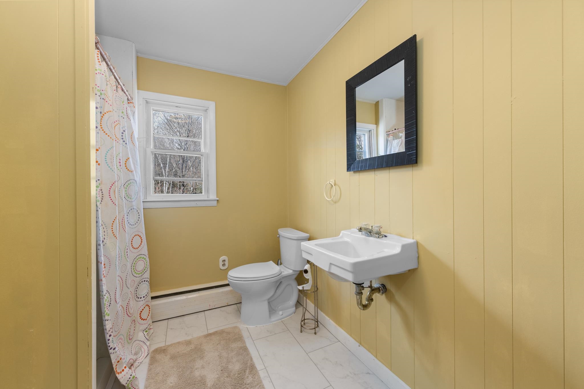 This 3/4 bathroom is situated between the 2 large 2nd floor bedrooms